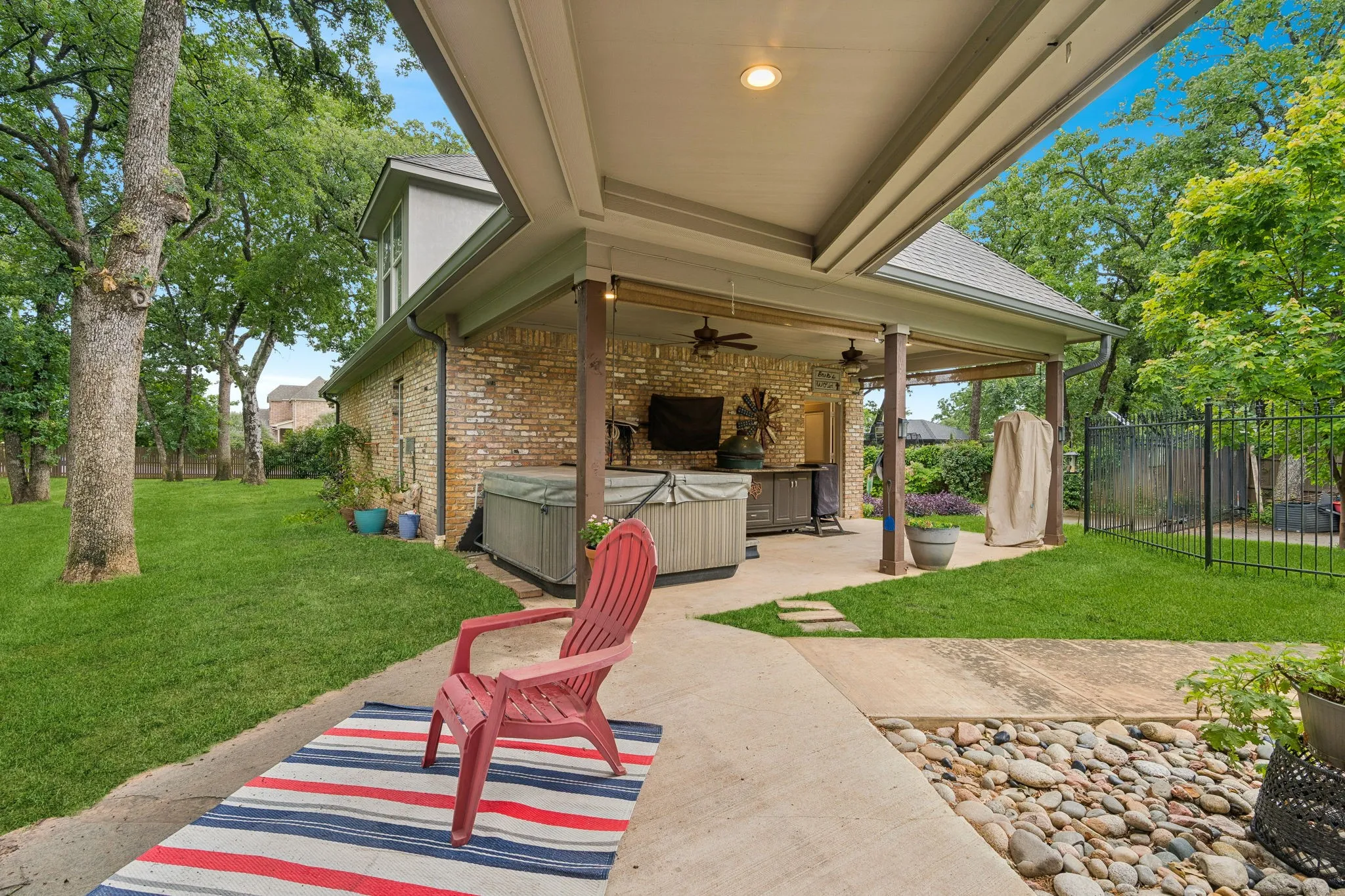 Breeze way from the main house to the pool house/mother in law suite. This building has an additional 2 car garage with plenty of storage.