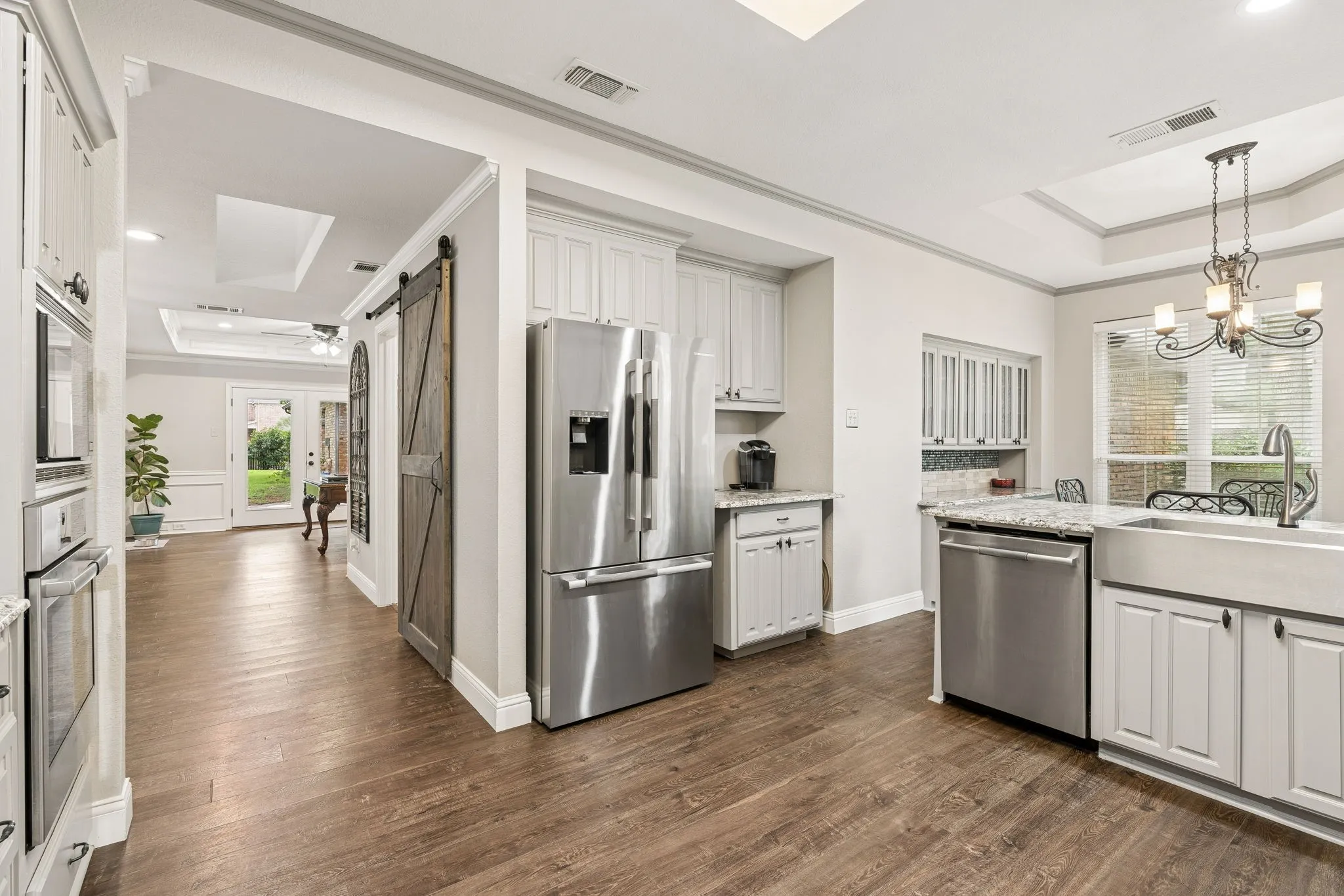 Kitchen showing the breakfast area with built in china cabinet or for extra storage.