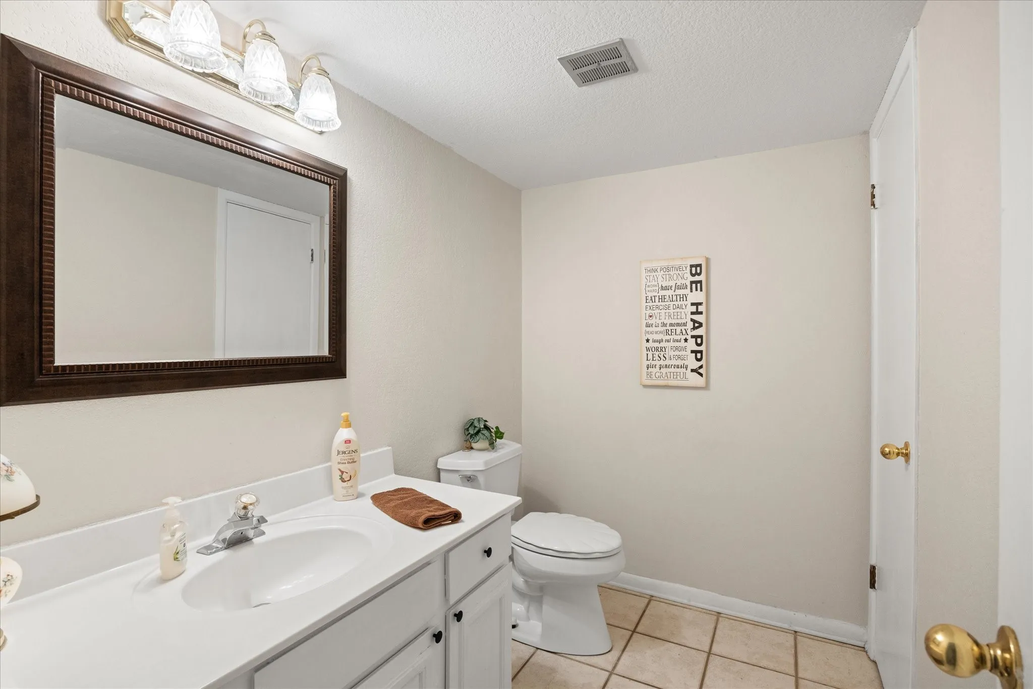 Convenient one half bathroom.