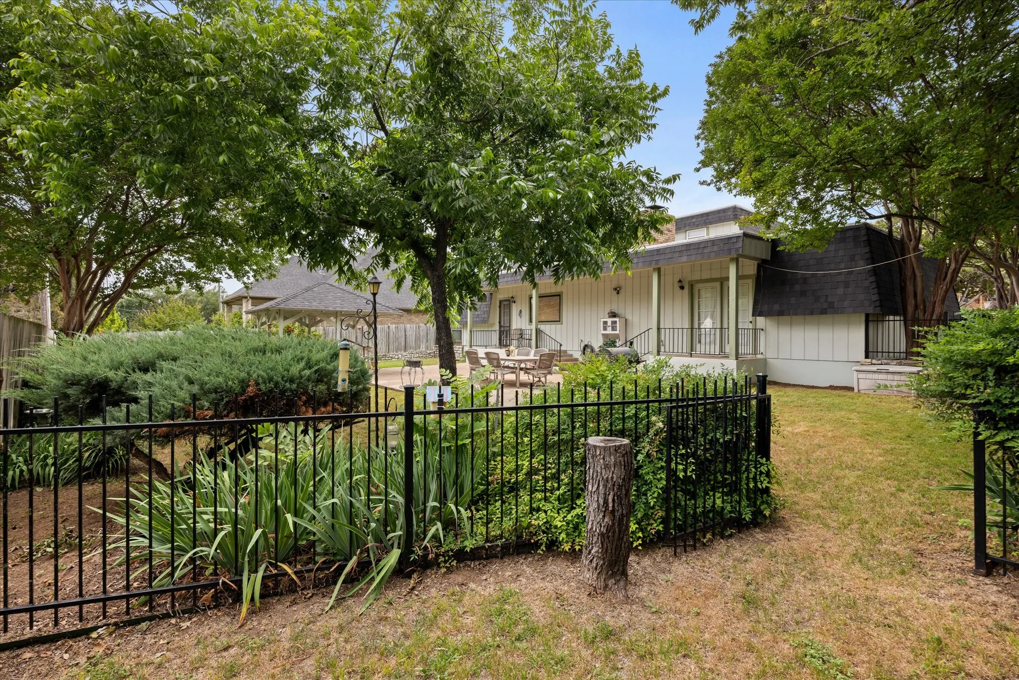 Another view of backyard and landscaping.