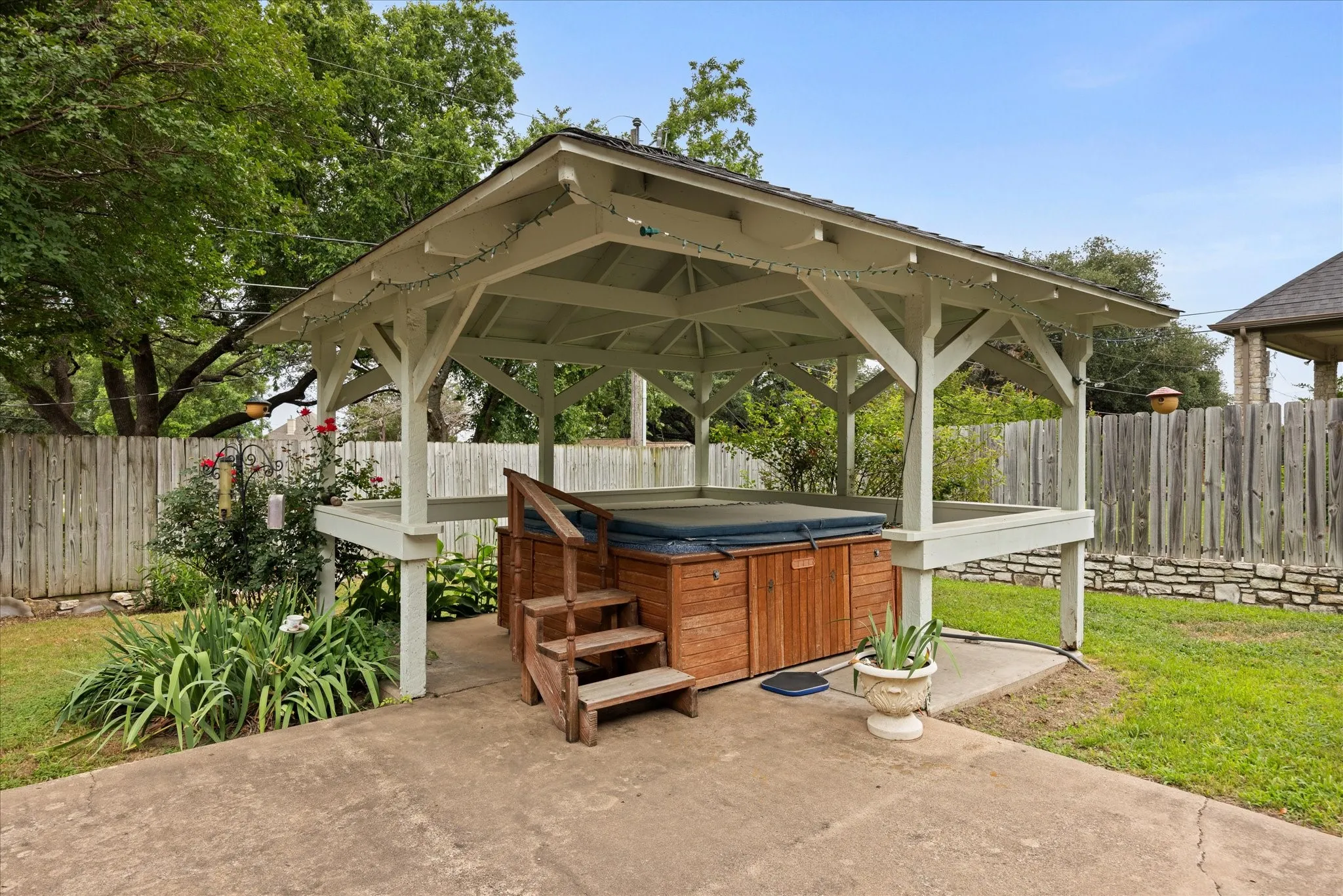 Very nice pergola and hot tub area.