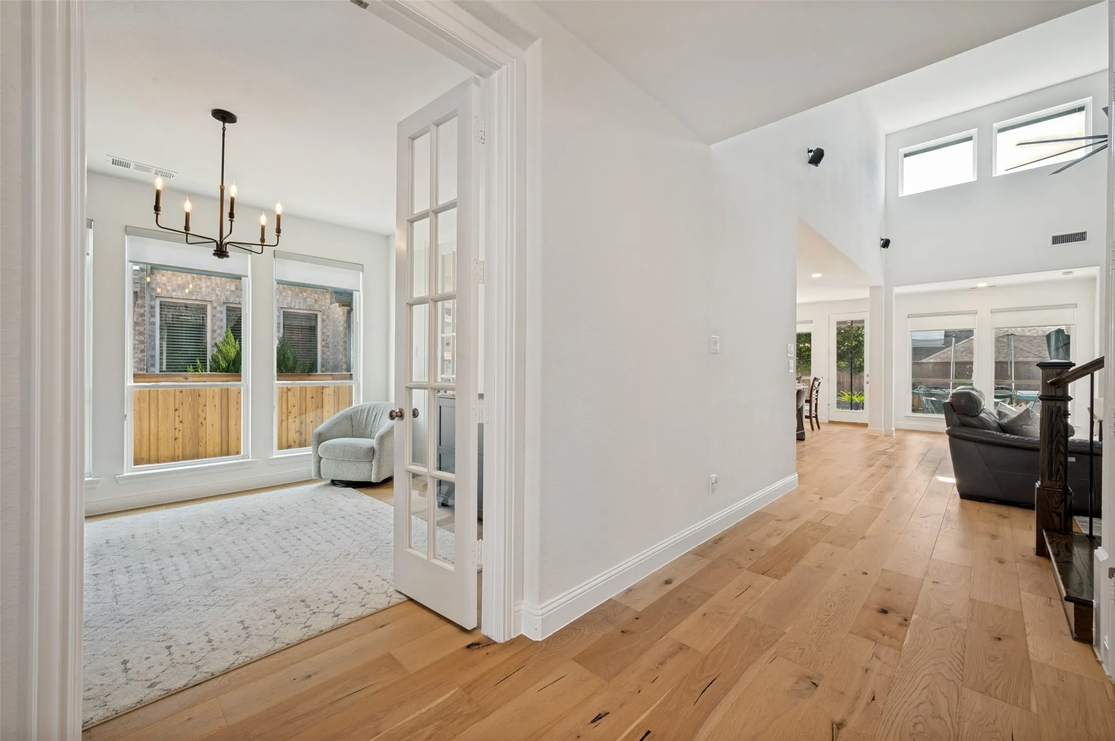This flex space is enclosed behind glass French doors and is perfect for a quiet study, work from home office, playroom or gym space away from the main living area