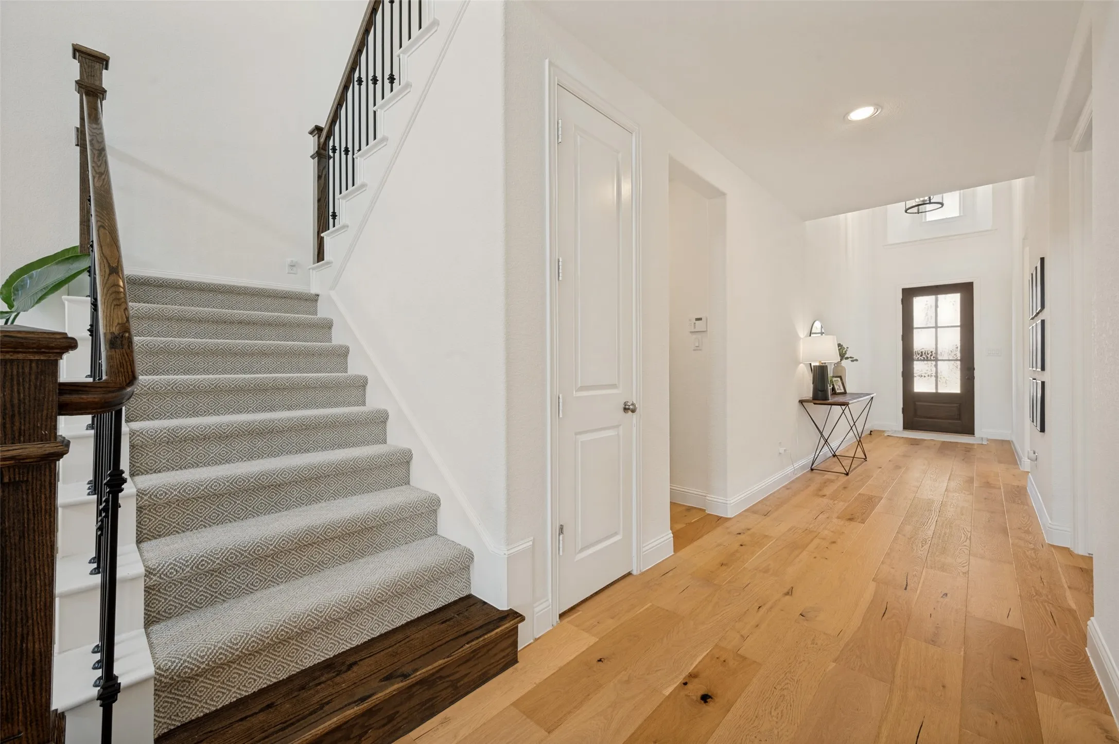 The entry way is a light and bright first impression as the open hallway and natural flooring offer a warm and welcoming first impression
