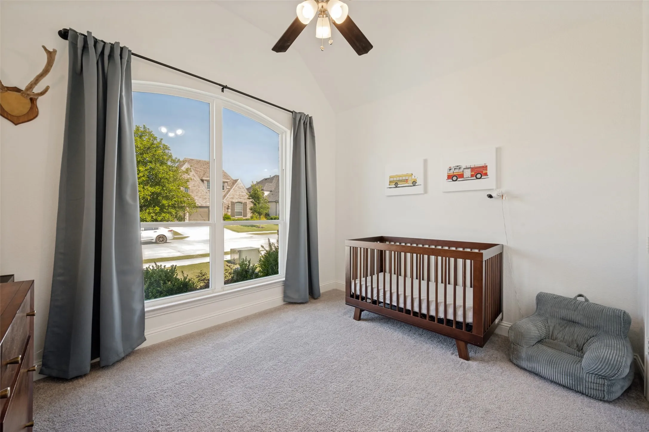 Main floor bedroom has large windows and heightened ceilings to open up this spacious room