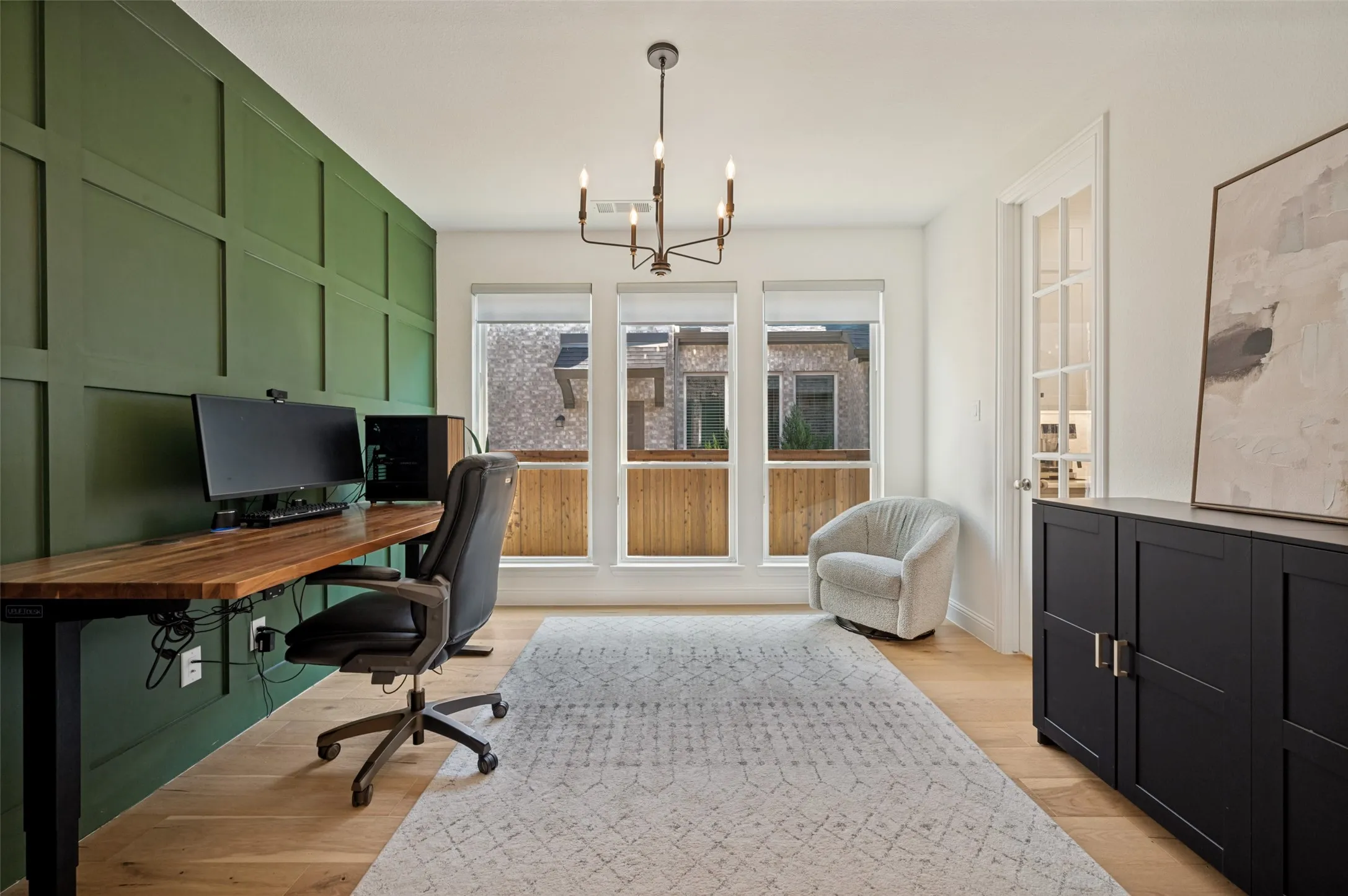 Trending access wall elevates this flex room ready to be used a stunning, private office, a play room or dedicated gym space within the privacy of French doors with convenient access to the kitchen area
