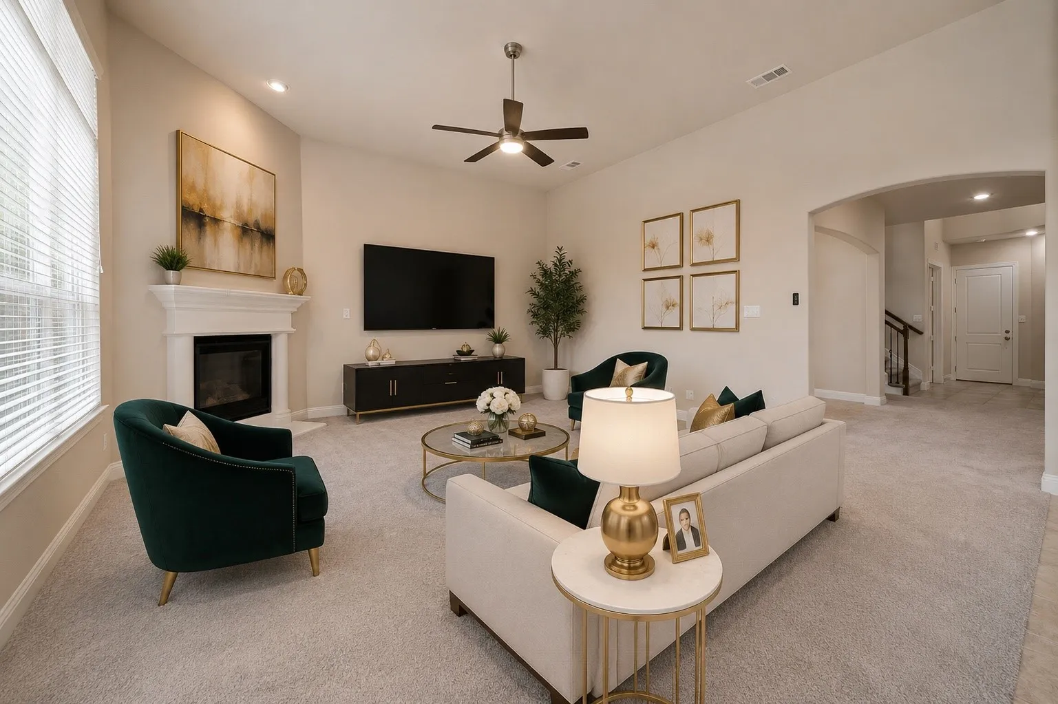 Living room with vaulted ceiling, contemporary fireplace, ceiling fan, carpet flooring, and arched doorway
