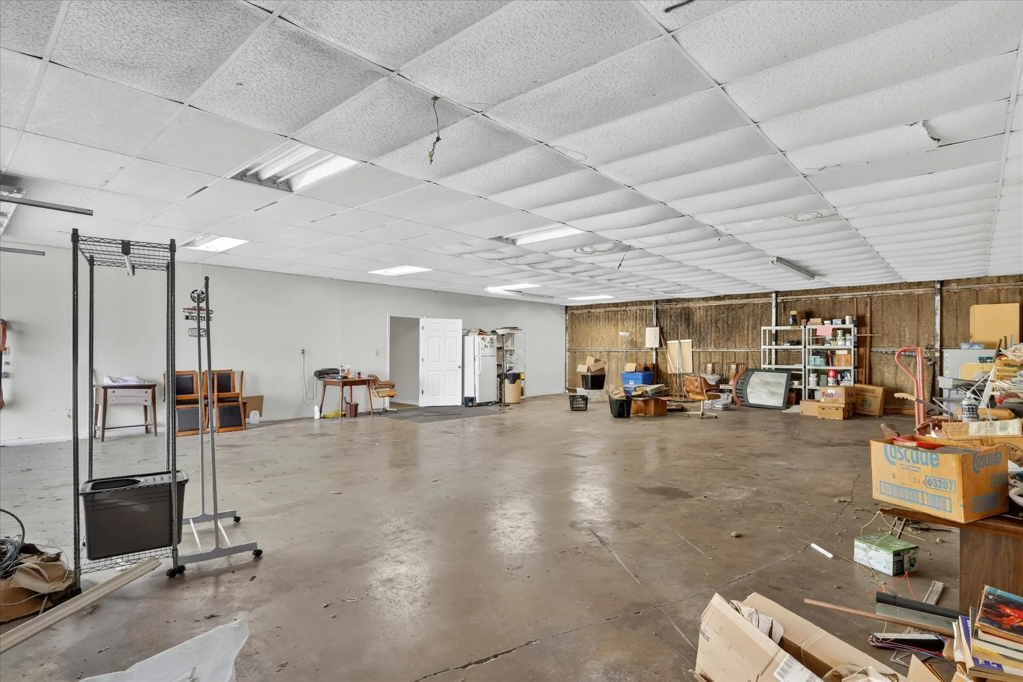 Spacious warehouse area with concrete flooring