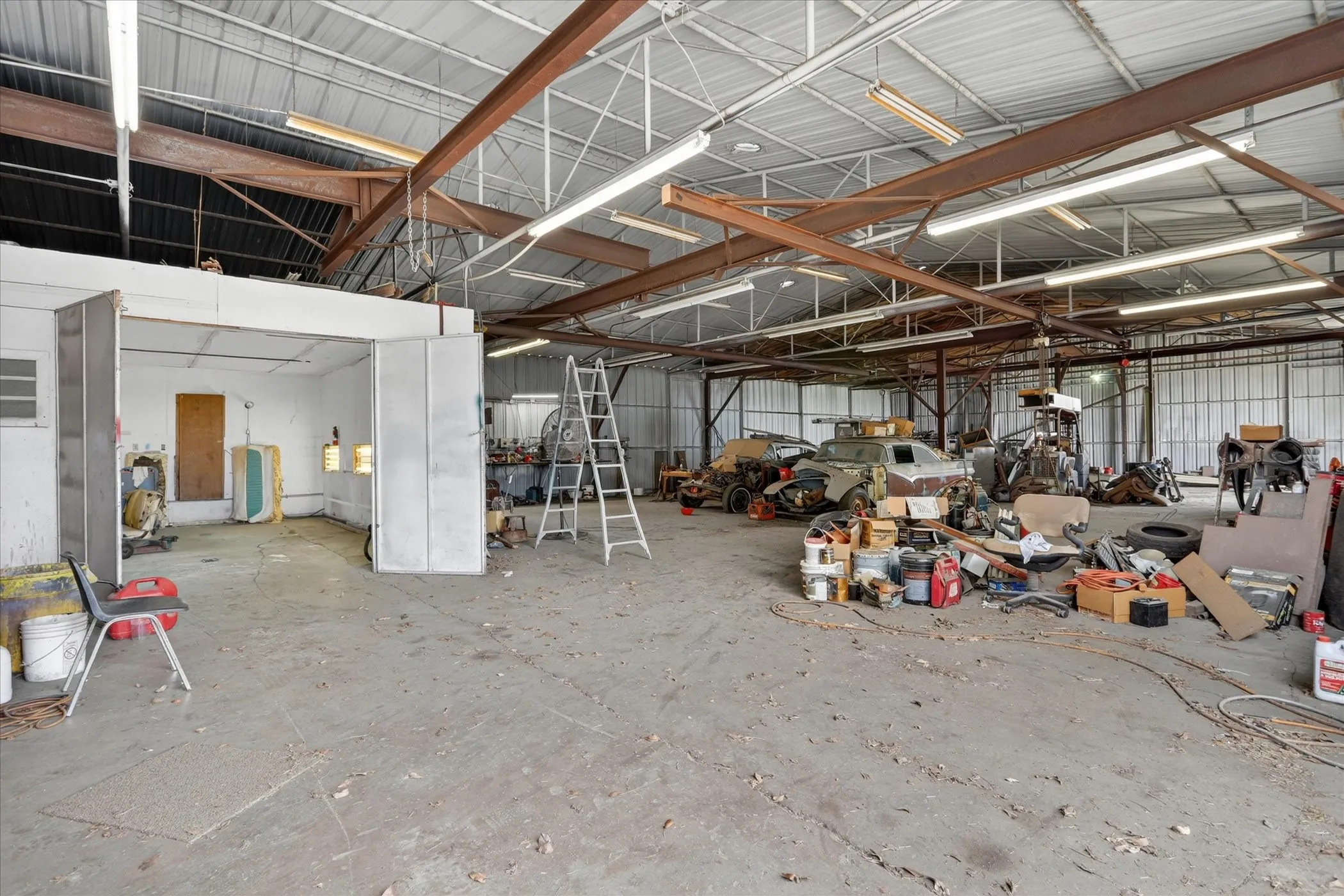 Spacious industrial interior featuring paint booth