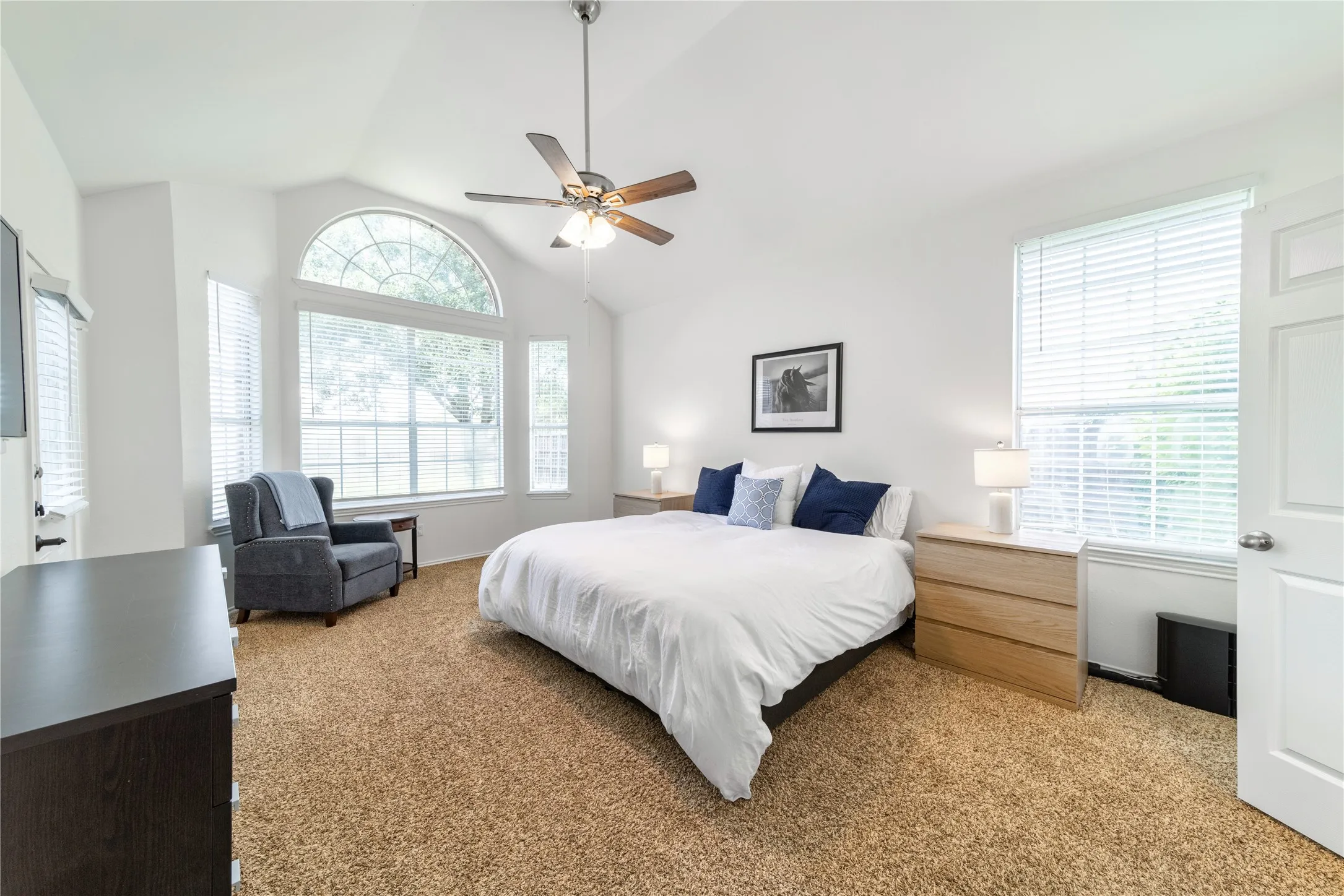 1st floor primary with vaulted ceilings and access to back patio