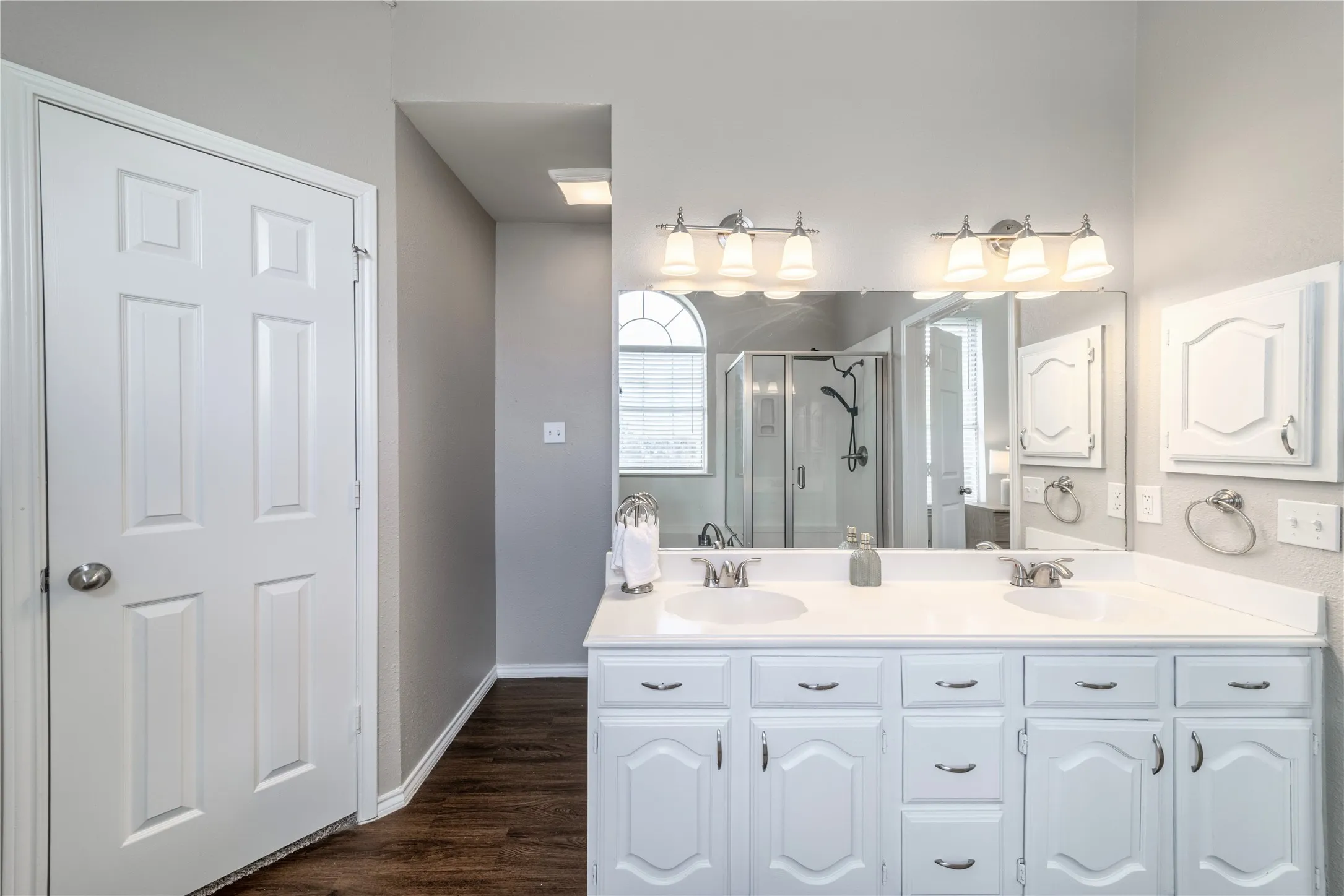 Primary bathroom with walk-in closets