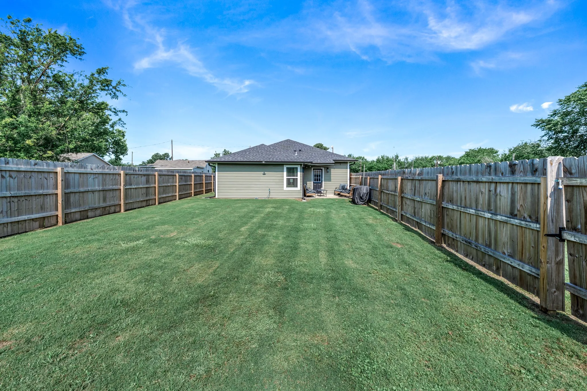 large yard offers lots of room for kids and pets