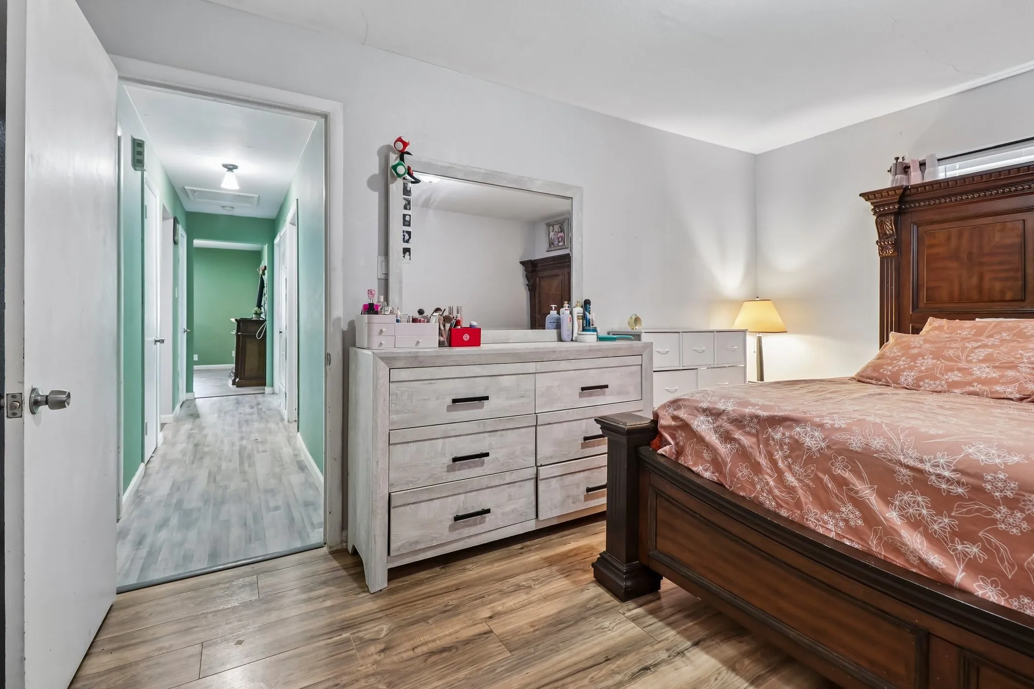 Wood-finish flooring throughout, with light-toned walls