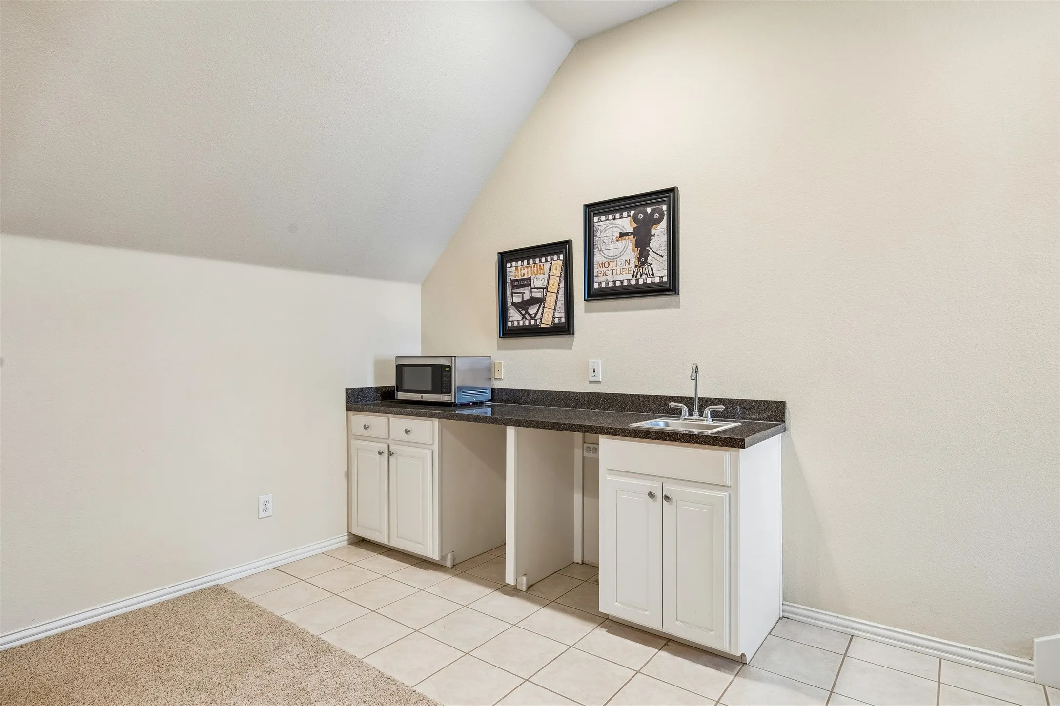 Upstairs wet bar plumbed for ice maker and drink fridge