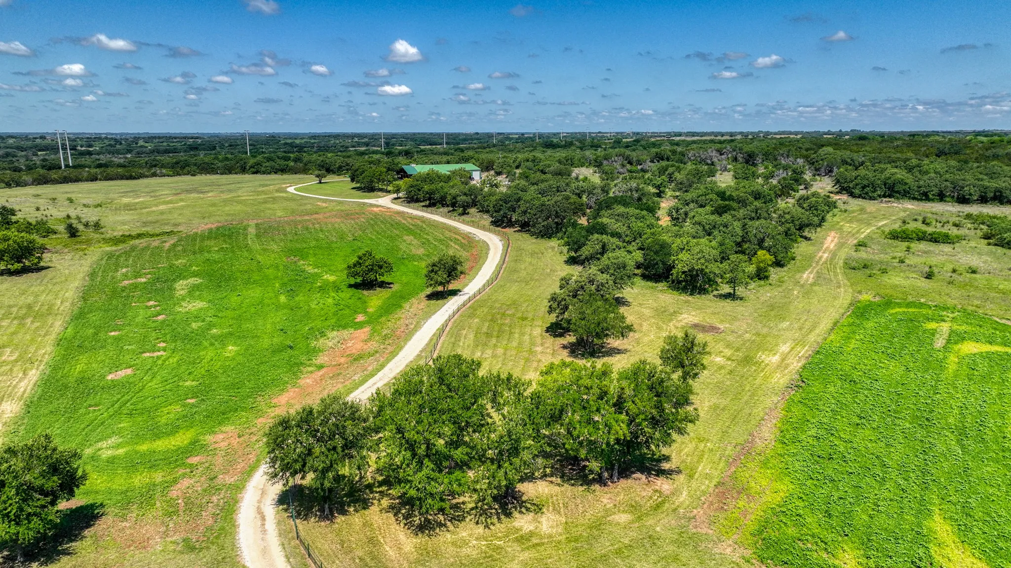 You'll love driving up this lovely winding road to your beautiful home. Spring deer mix planted on the left. Acreage on the right is fenced with pond and can be purchased with the home and approx. 25 acres.