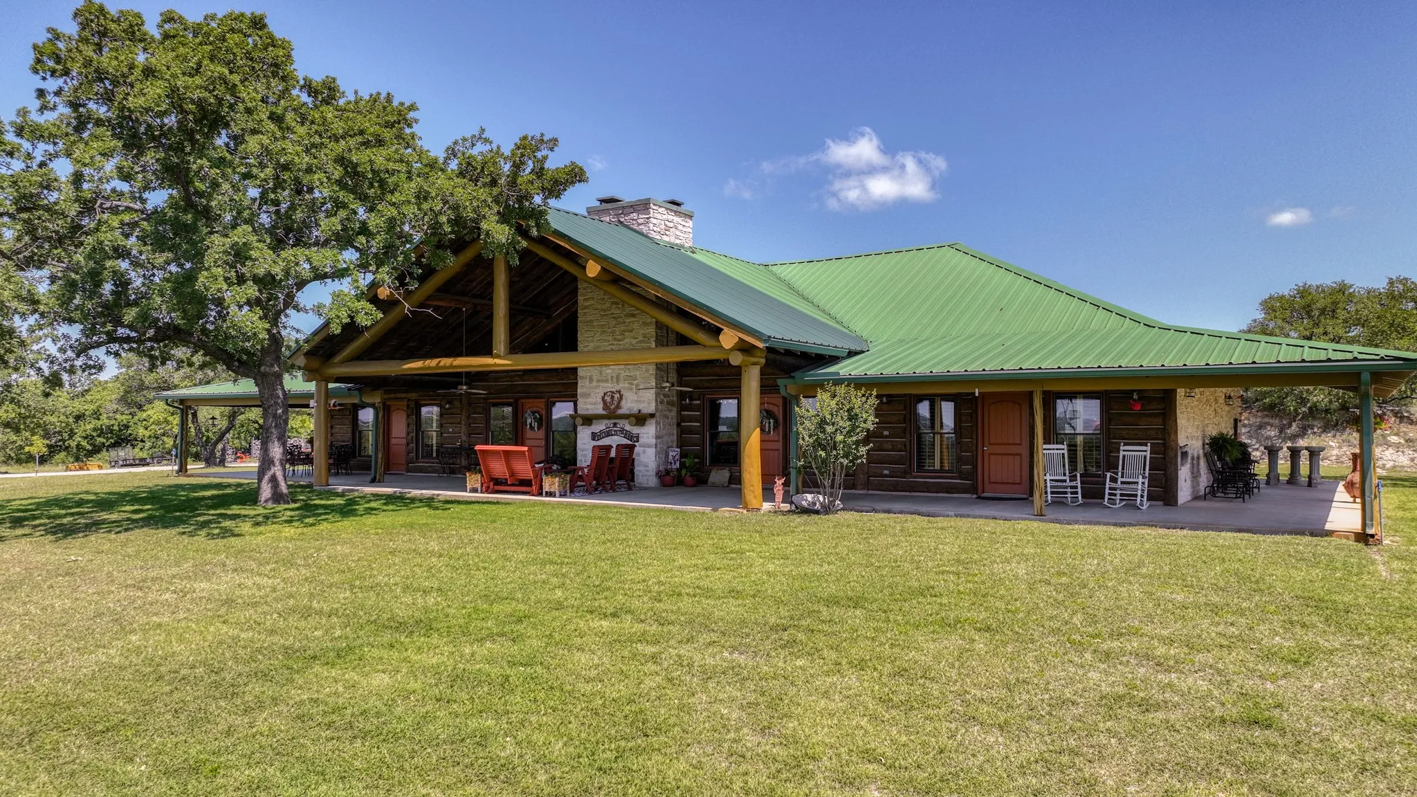 This amazing spacious  wrap around porch provides several different seating and dining areas to enjoy. Watch the deer and other wildlife grazing in the fields.