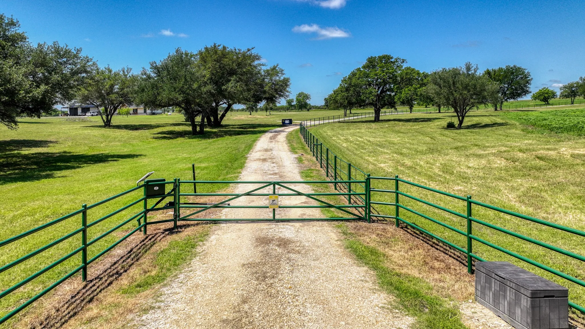 Electronic gate entry and pipe fencing. The left boundary is ready for the fencing of your choice.