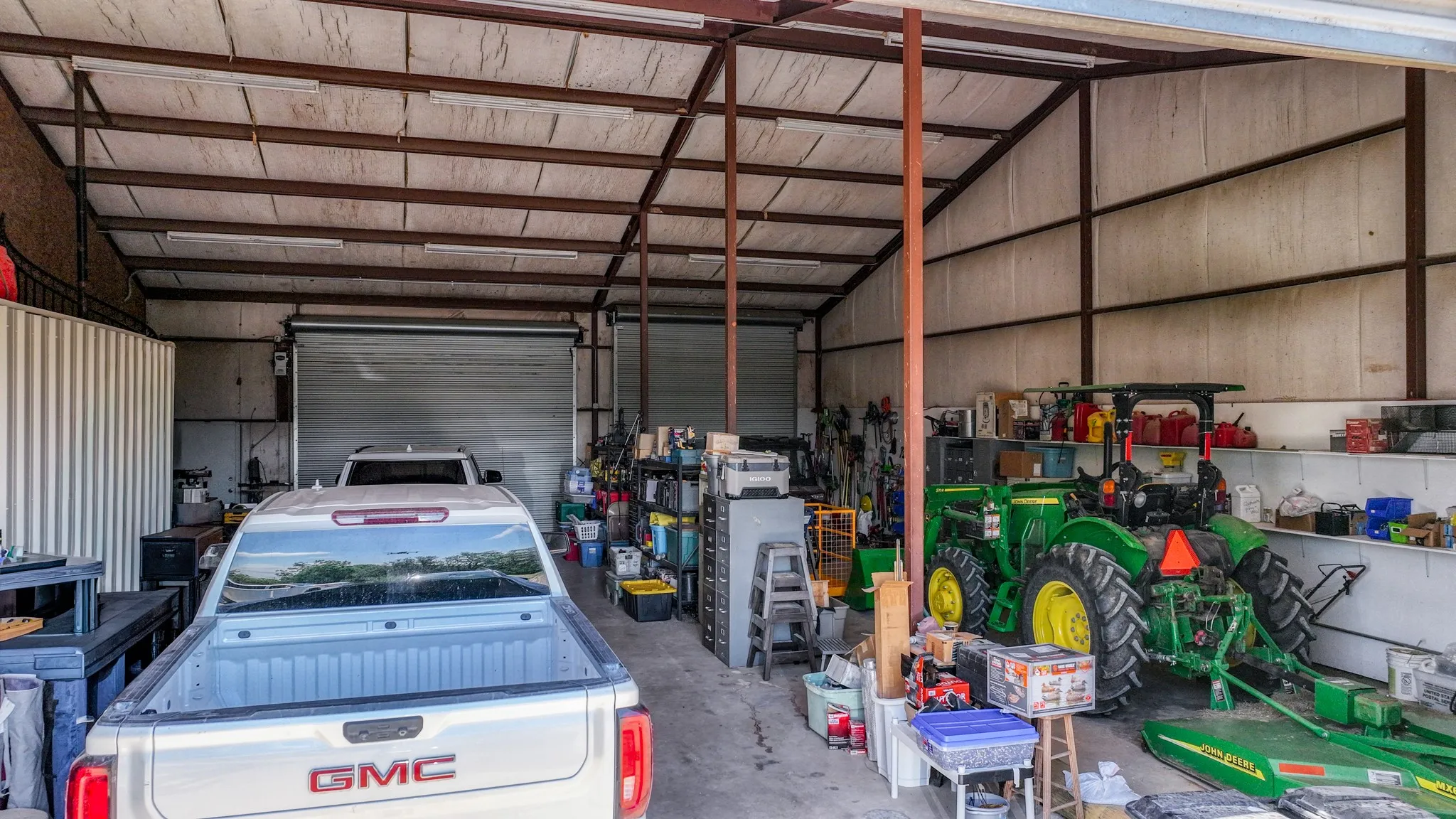 Very large custom built garage with an added upstairs room and a half bath on the garage level.