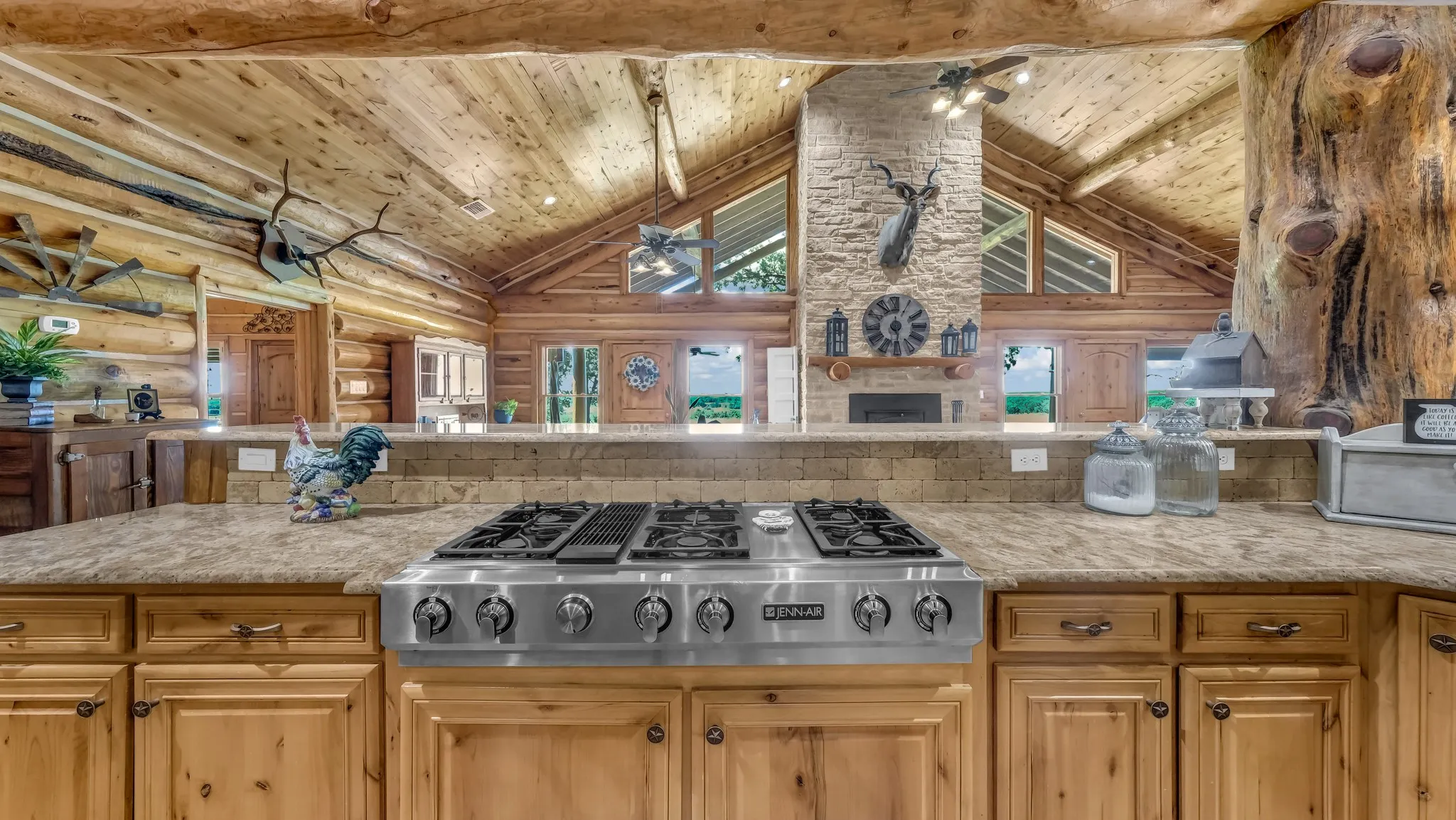 You will love cooking on this 6 burner Jenn-Air gas cooktop with its own exhaust system. The burners change out for a griddle, or a grill for steaks