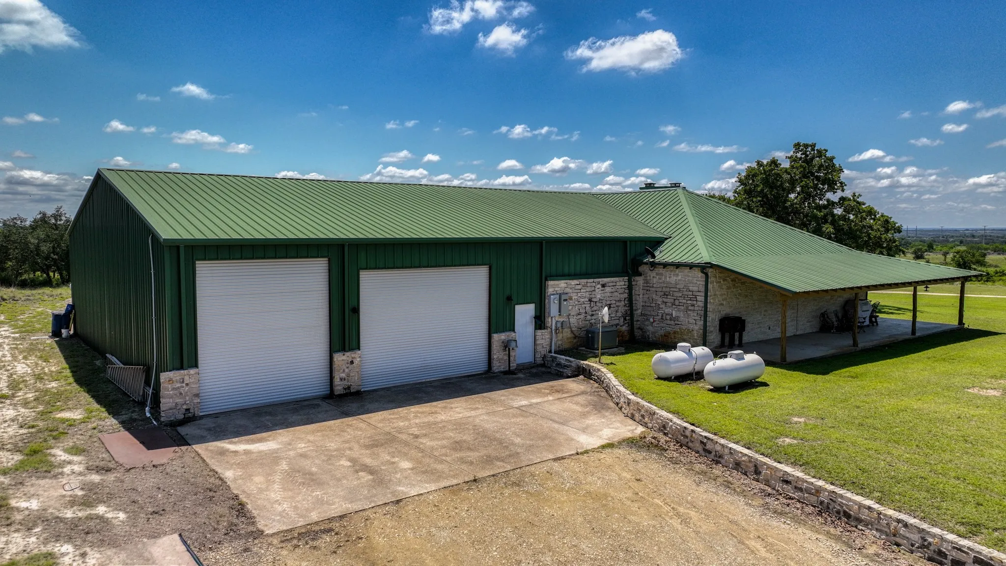 This home is off grid ready featuring a generator and two dedicated 250 gallon propane tanks.