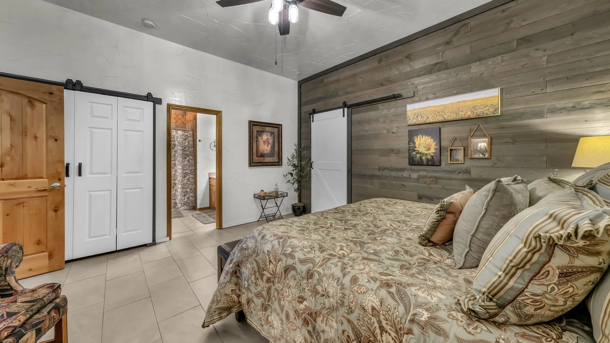 Guest bedroom with two large closet spaces with another door straight into the media/safe room!