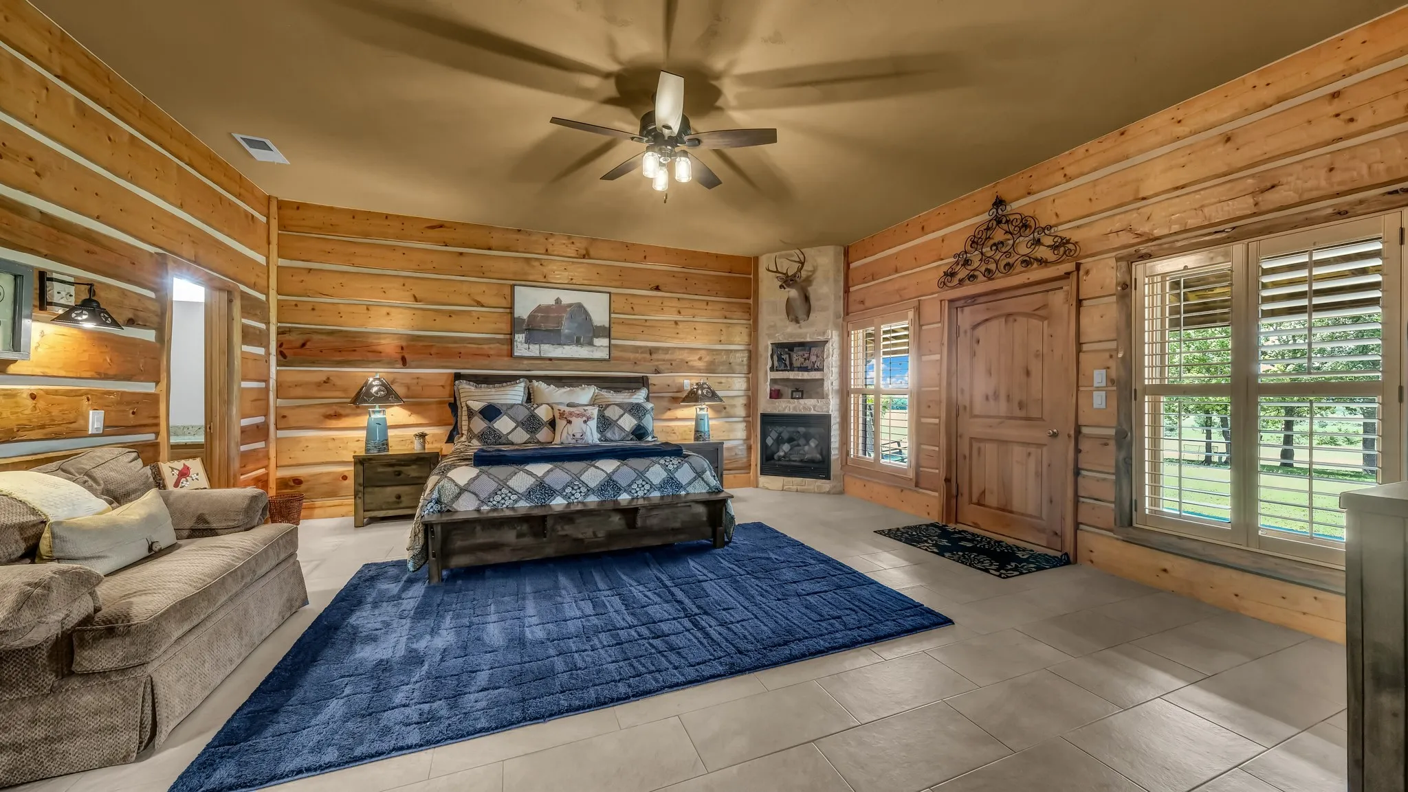 Primary bedroom with a door straight to the porch where you can  enjoy all the beauty and tranquility relaxing in your rocking chairs.