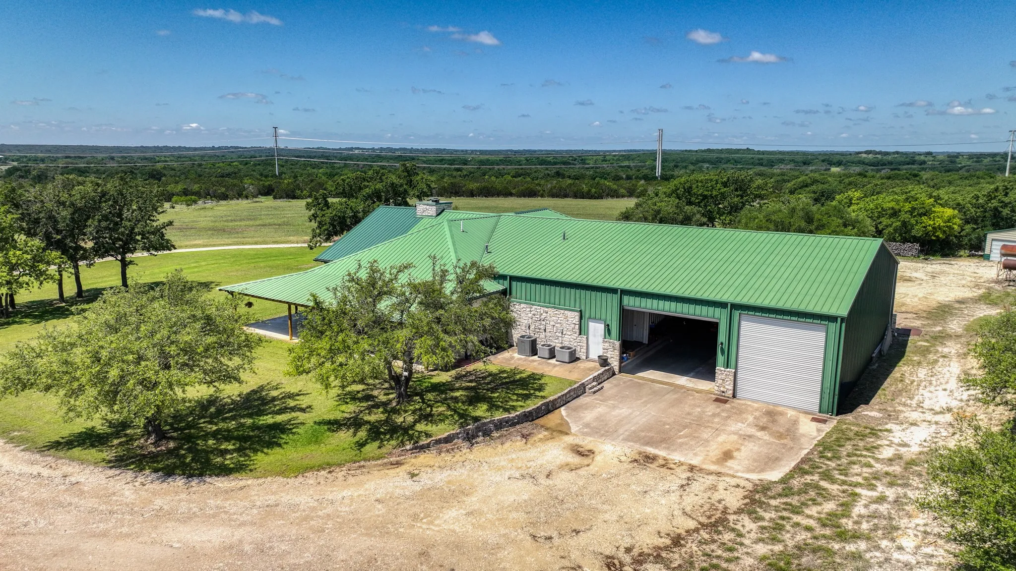 Custom built garage has vehicle size and RV size garage doors on both sides so you can drive all the way through to the driveway on the other side.