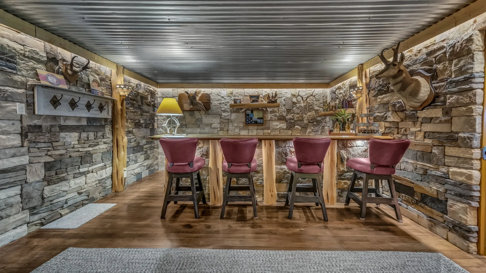 This awesome bar area also has two wine refrigerators.