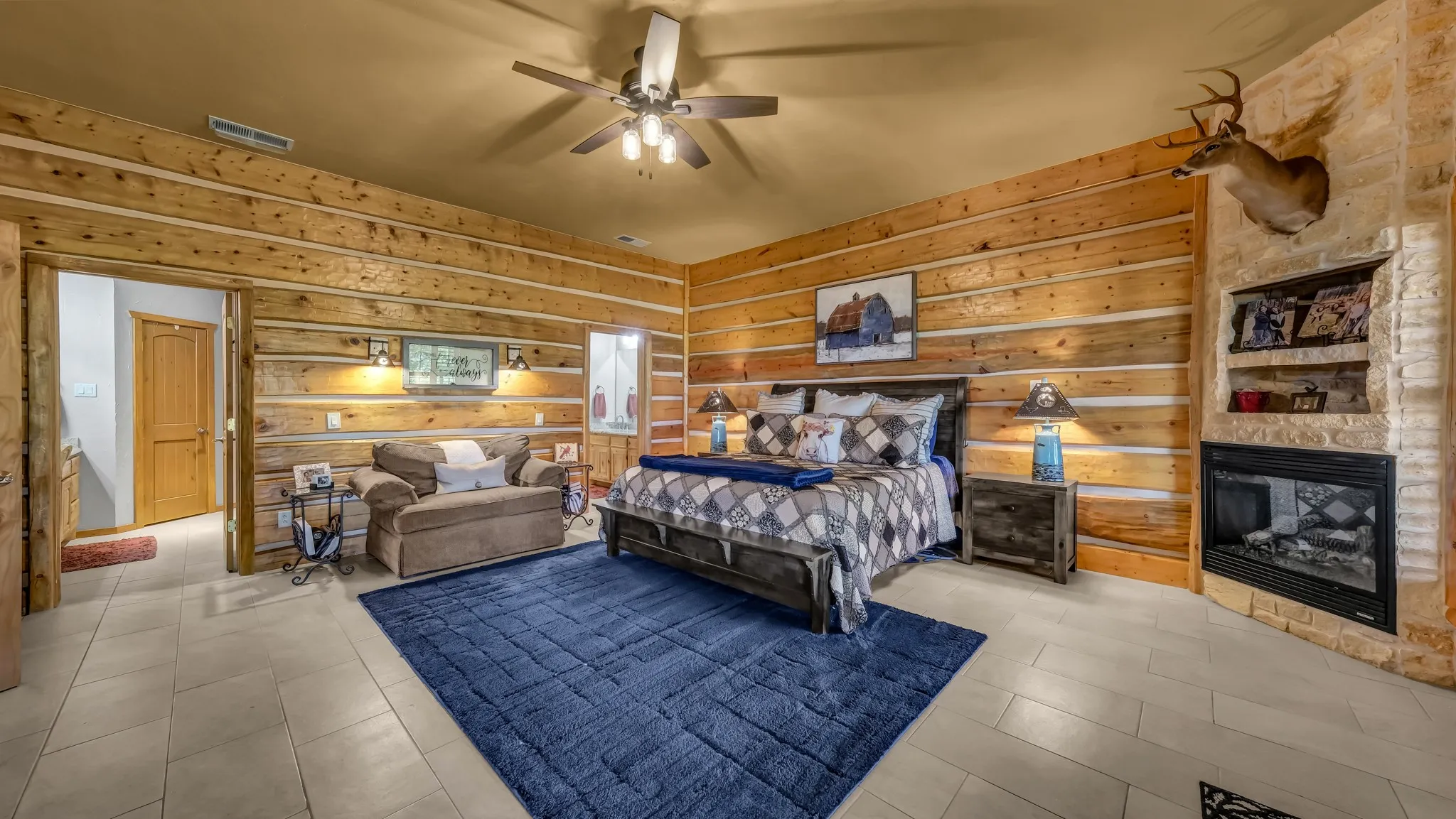 The primary bedroom has so much room to enjoy your own privacy and a nice warm fire from the propane fueled  fireplace.
