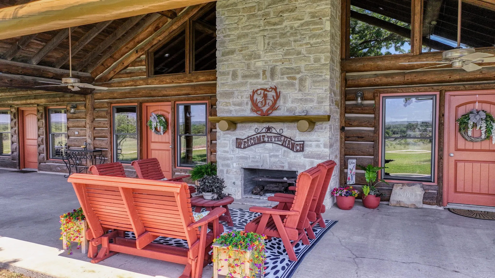 Beautiful wood burning fireplace on the front porch. You can cook on the built in grate too!