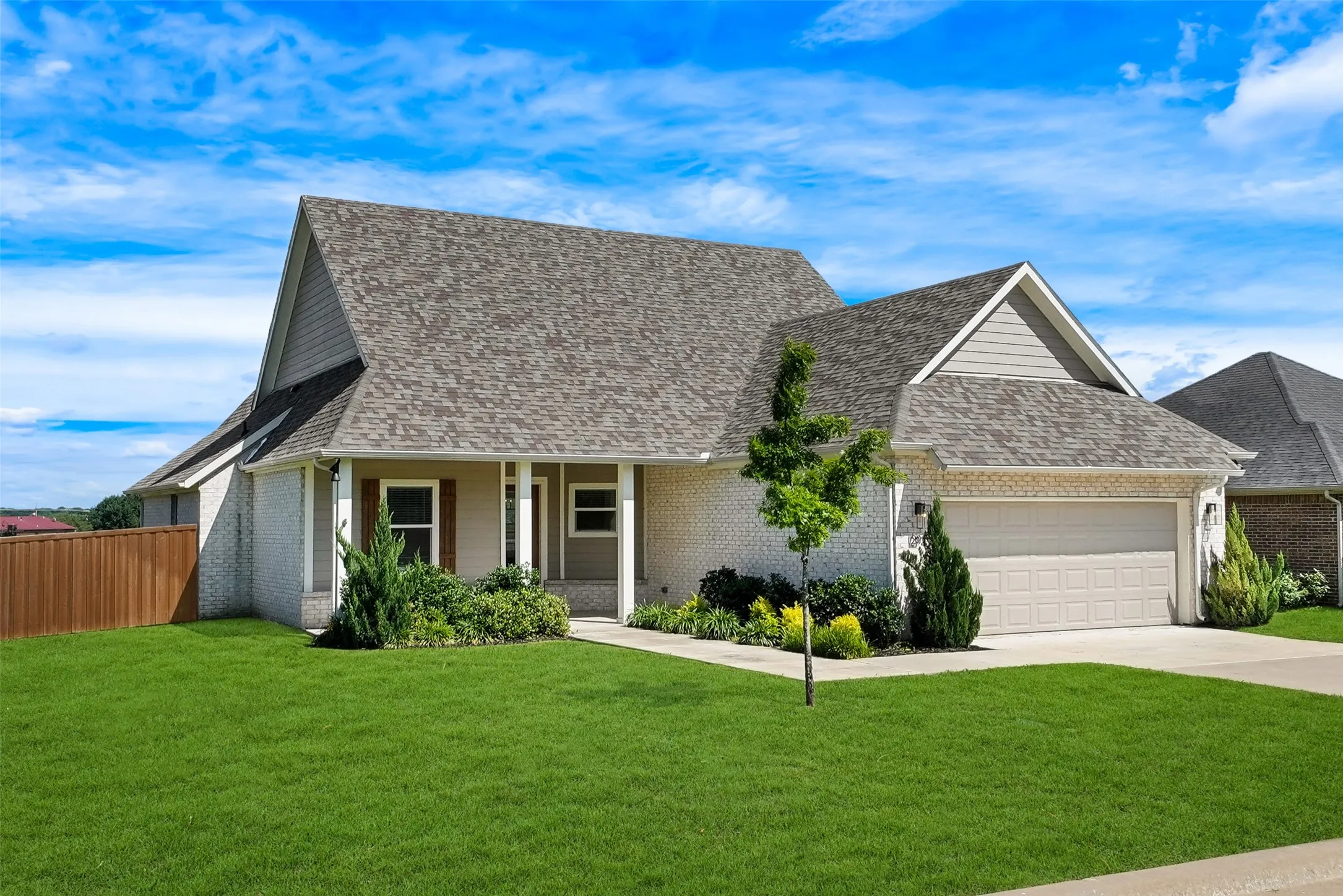 Brick and siding exterior with a covered front porch