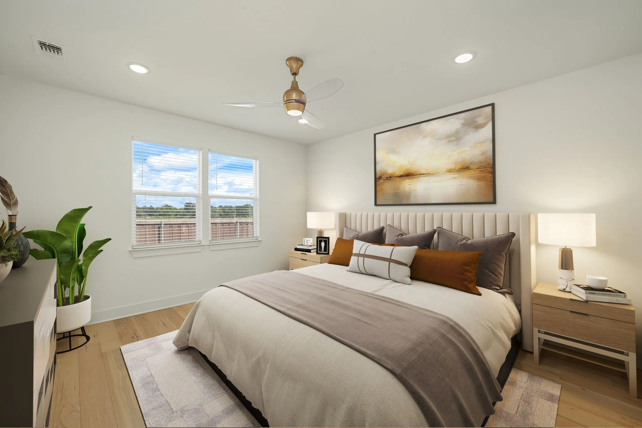 Bedroom featuring light-tone wood-finish flooring, recessed lighting, and a ceiling fan