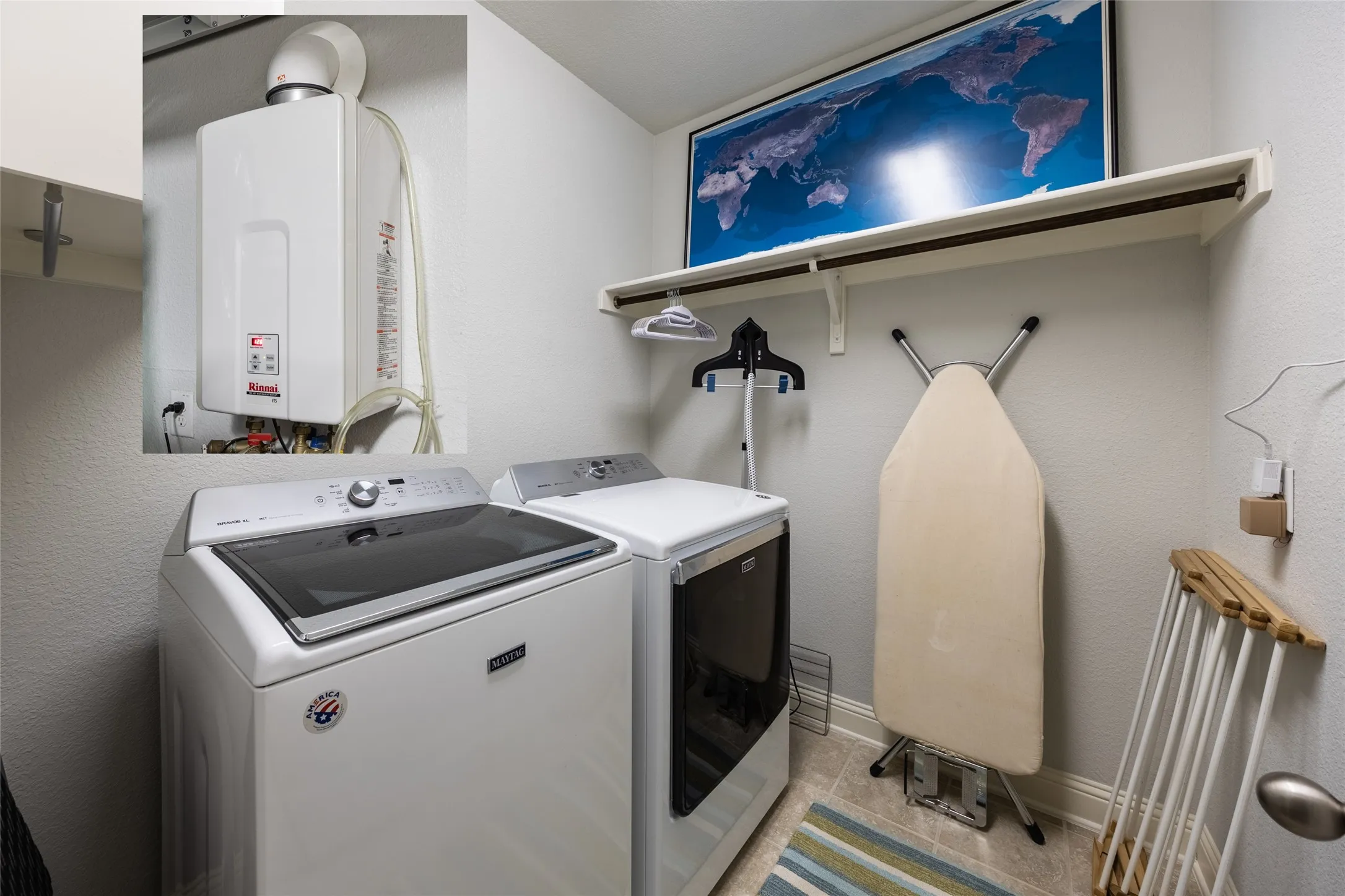 Upstairs laundry room.  Photo provides inset of tankless hot water heater located in garage.