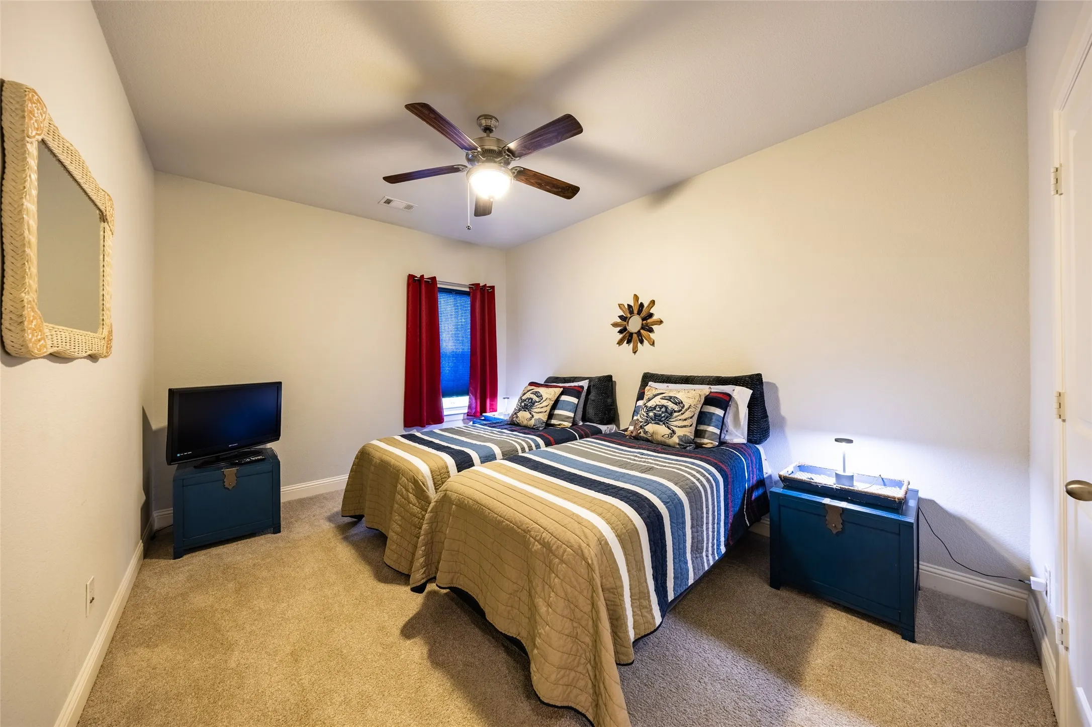 Upstairs guest room. Red window treatments convey.