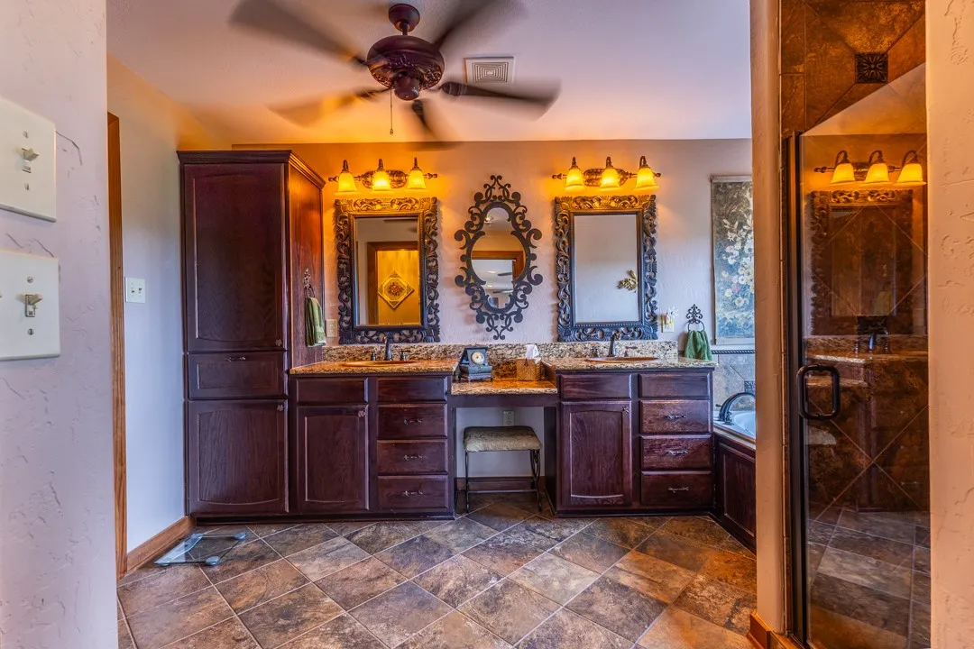The primary ensuite bath features a separate shower, soaking tub, double sink vanity, storage cabinets, water closet and a large walk-in wardrobe closet with more great storage.