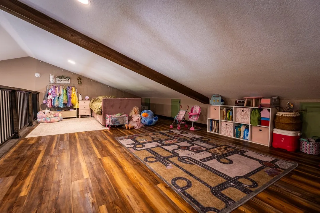 The loft over the bedroom is an ideal play space, game room, tv room (additional photos available) or study.