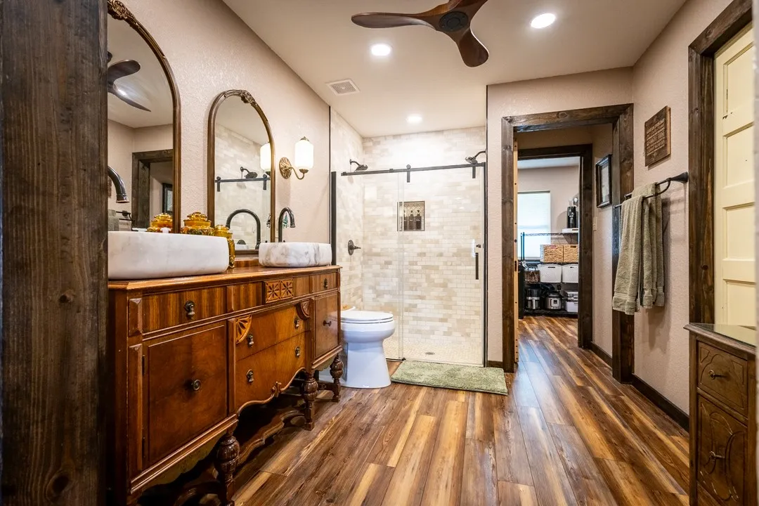 Large bathroom with walk-in closet and walk-in shower is also accessible from the laundry room.