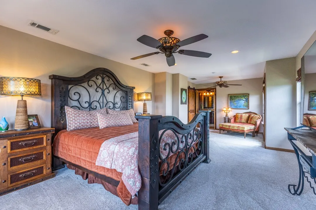 The large primary suite features a cozy sitting area and spacious en-suite bath.