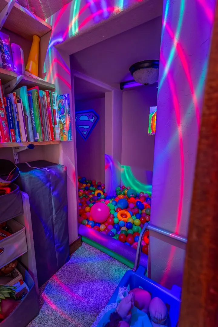 Main floor bedroom features a closet that's been converted to a fun kids play area!