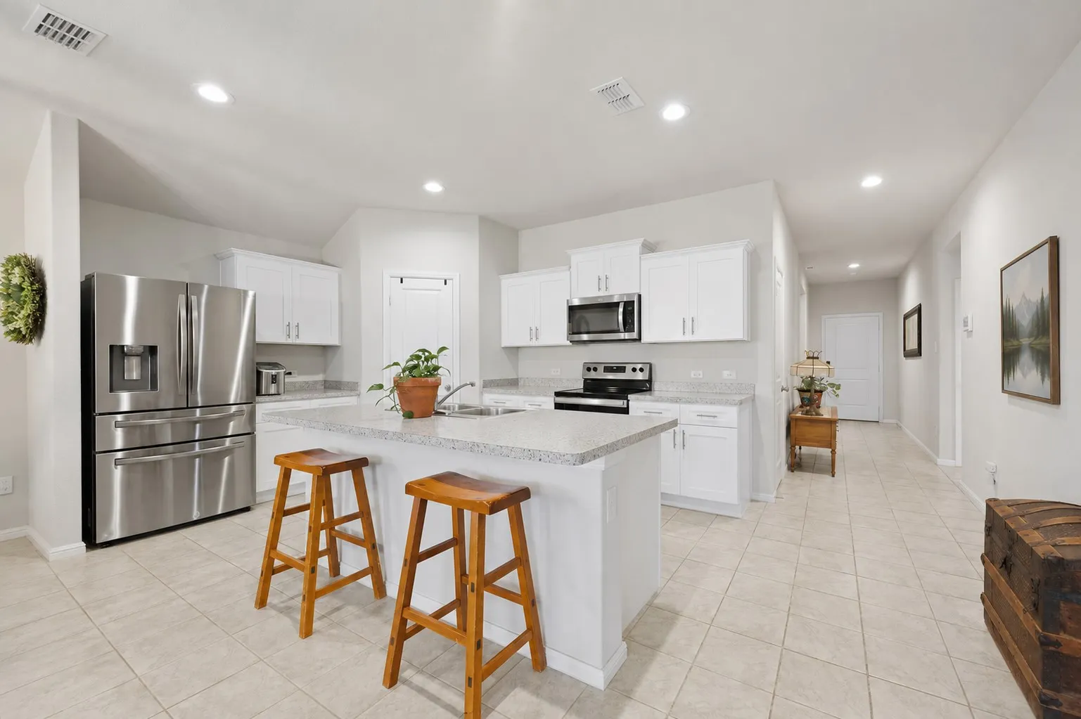 Kitchen with island.  Great place to relax with your morning coffee or late night snack.