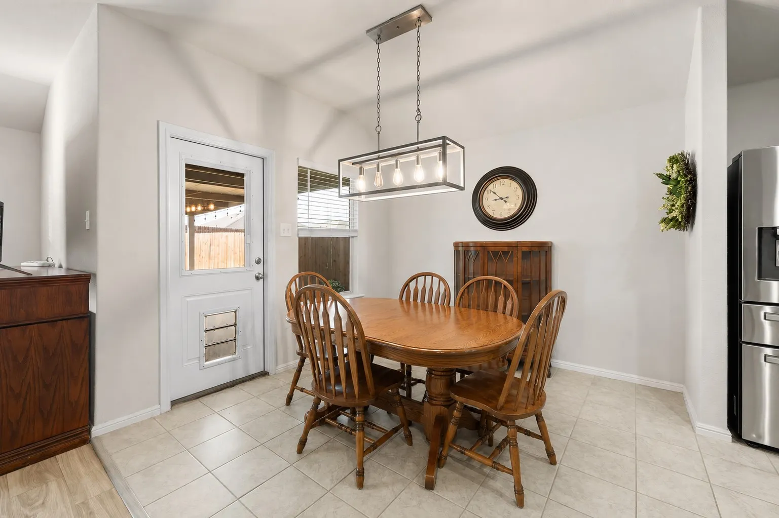 Dining area with open flow to both the kitchen and the living room.