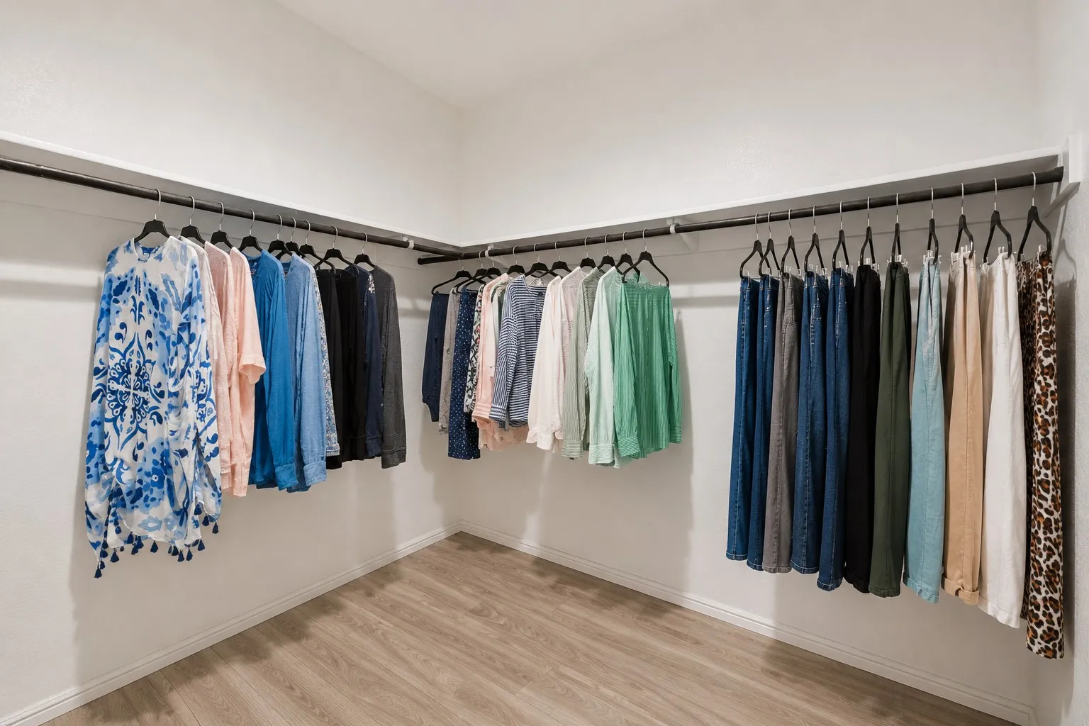 En-suite bath continues with a large walk-in closet.