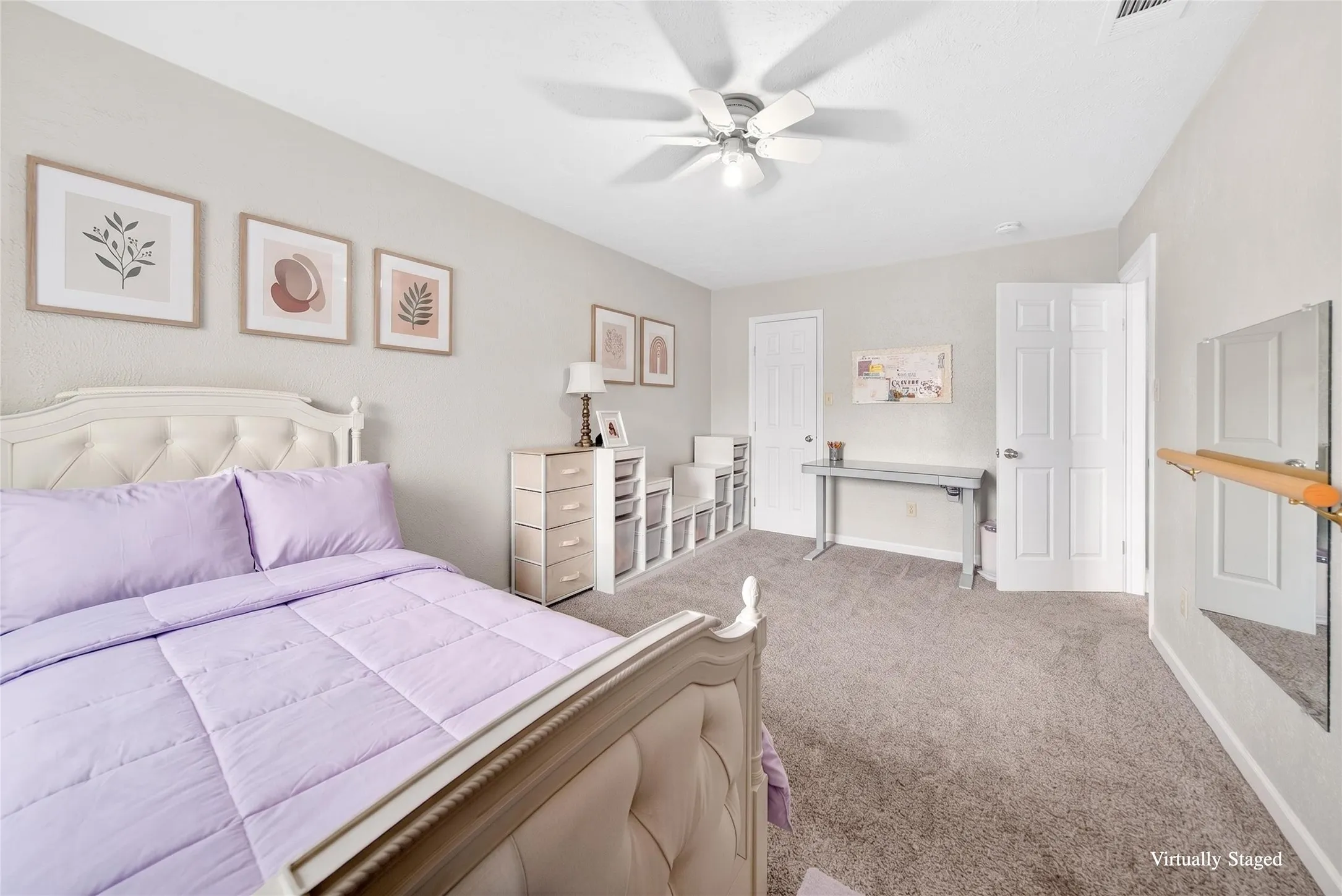 Carpeted room featuring a white ceiling fan with light, light gray painted walls, and white paneled doors