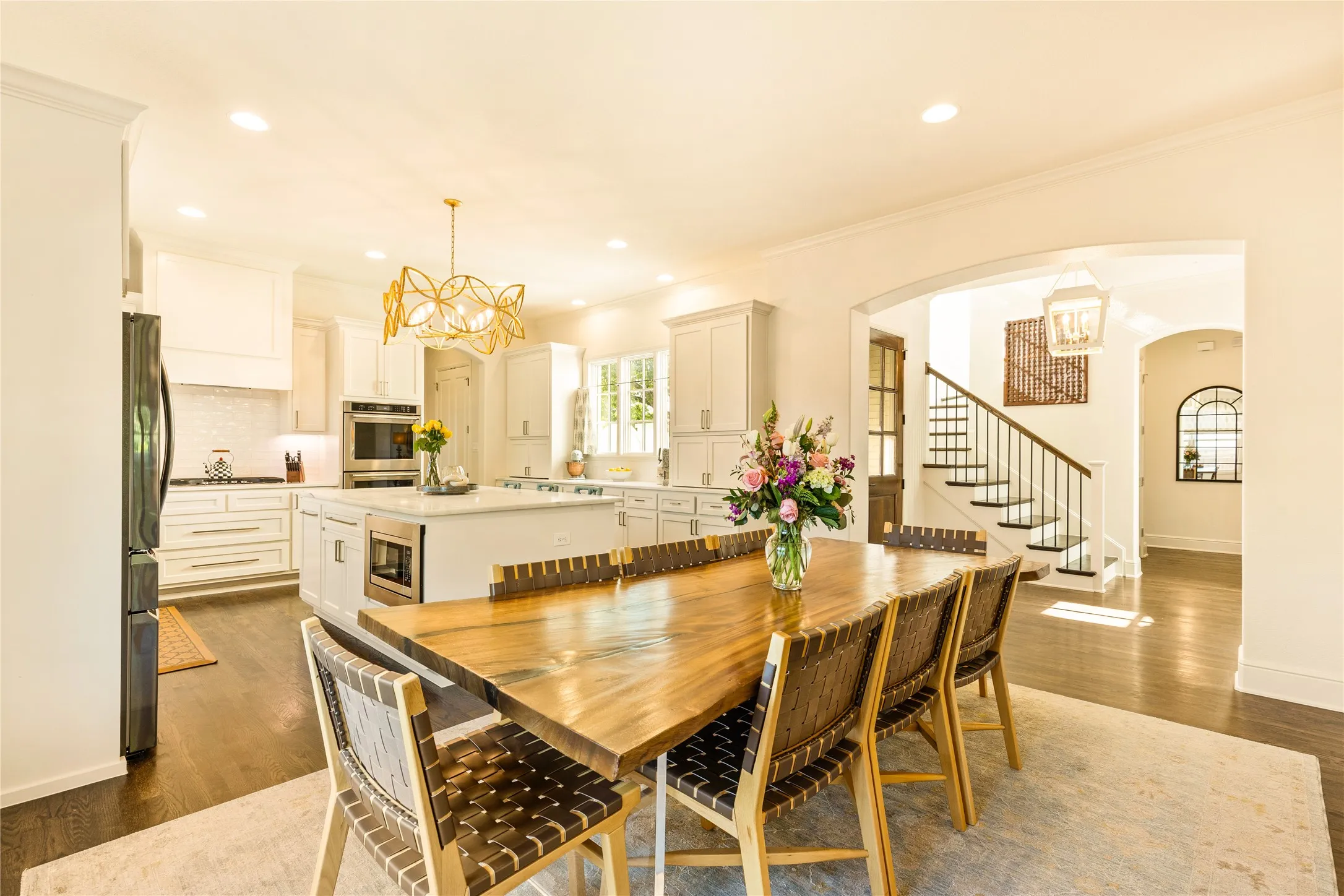 Spacious dining area flows seamlessly into the gourmet kitchen, creating an inviting open concept space perfect for gatherings and everyday entertaining.