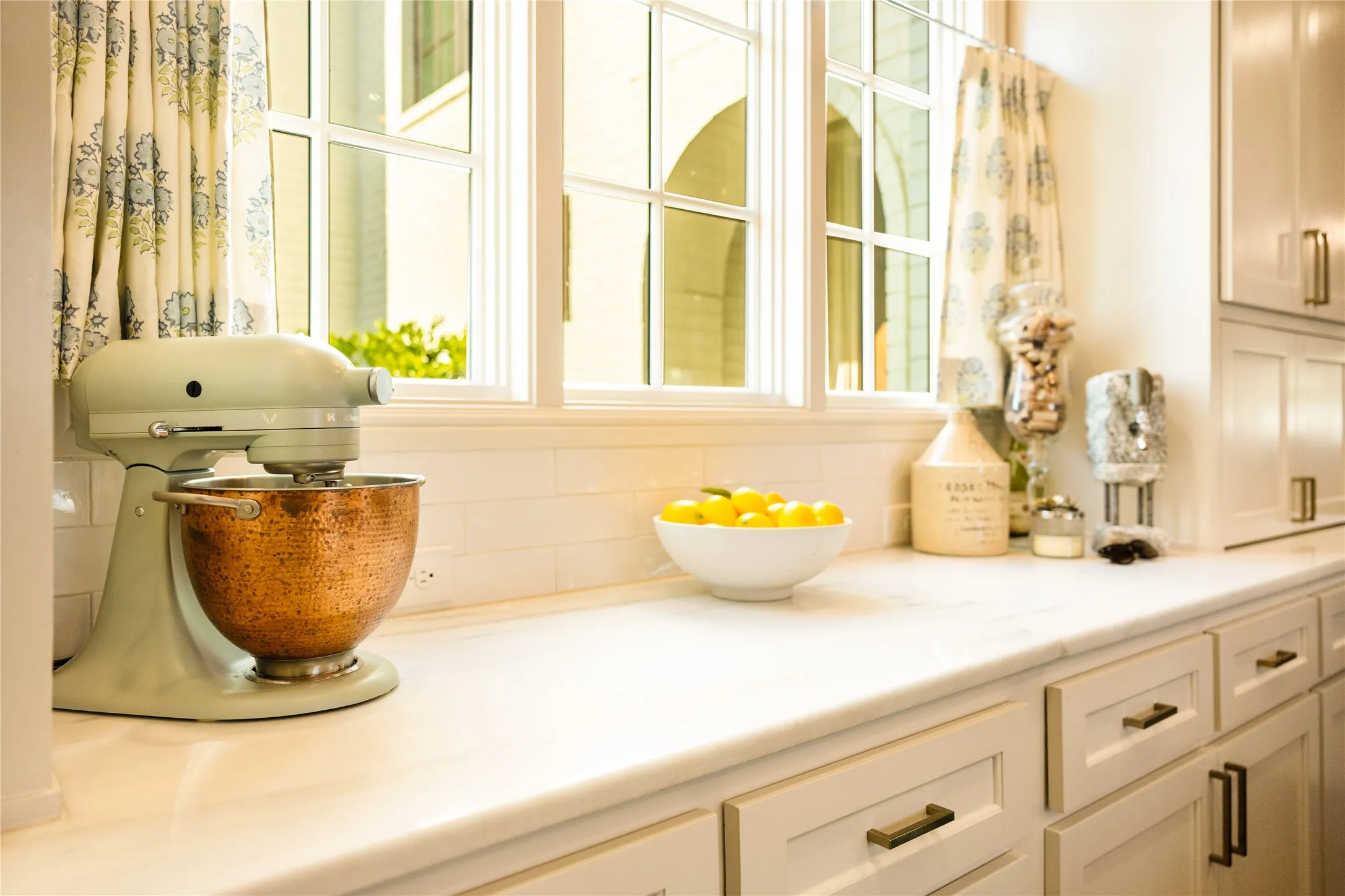 Sunlit kitchen details and soft designer finishes create a warm, inviting atmosphere with timeless appeal.