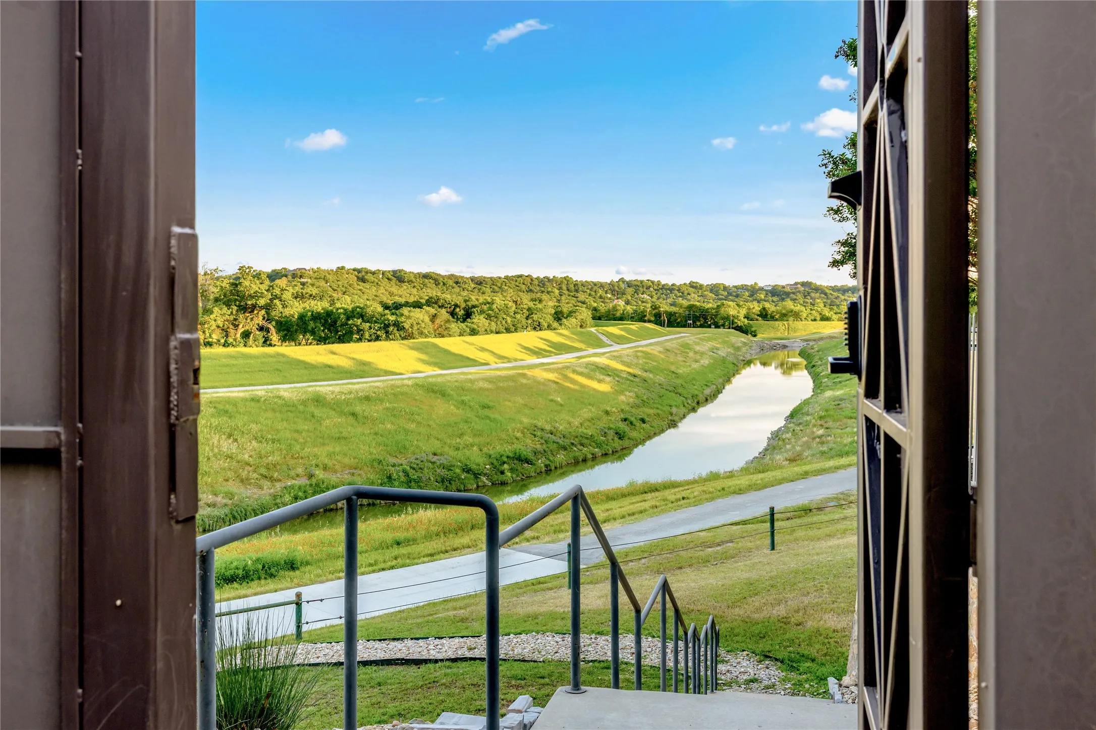 Direct access to the Trinity Trails walking path provides a scenic connection to miles of trails, green space, and outdoor recreation just moments from the home.