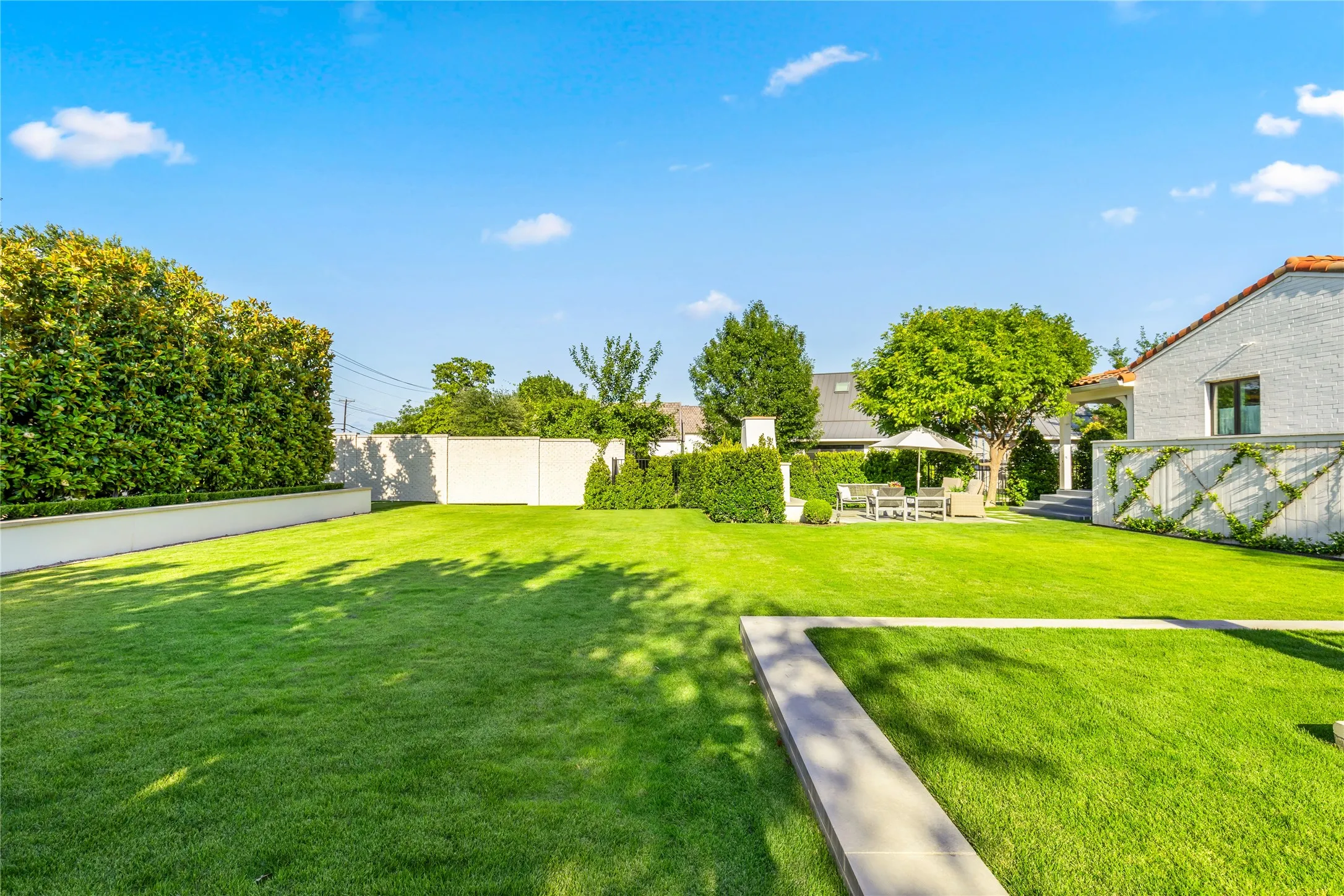 Expansive backyard offers endless possibilities for outdoor living, play, or future enhancements with lush green space and a peaceful, private setting.