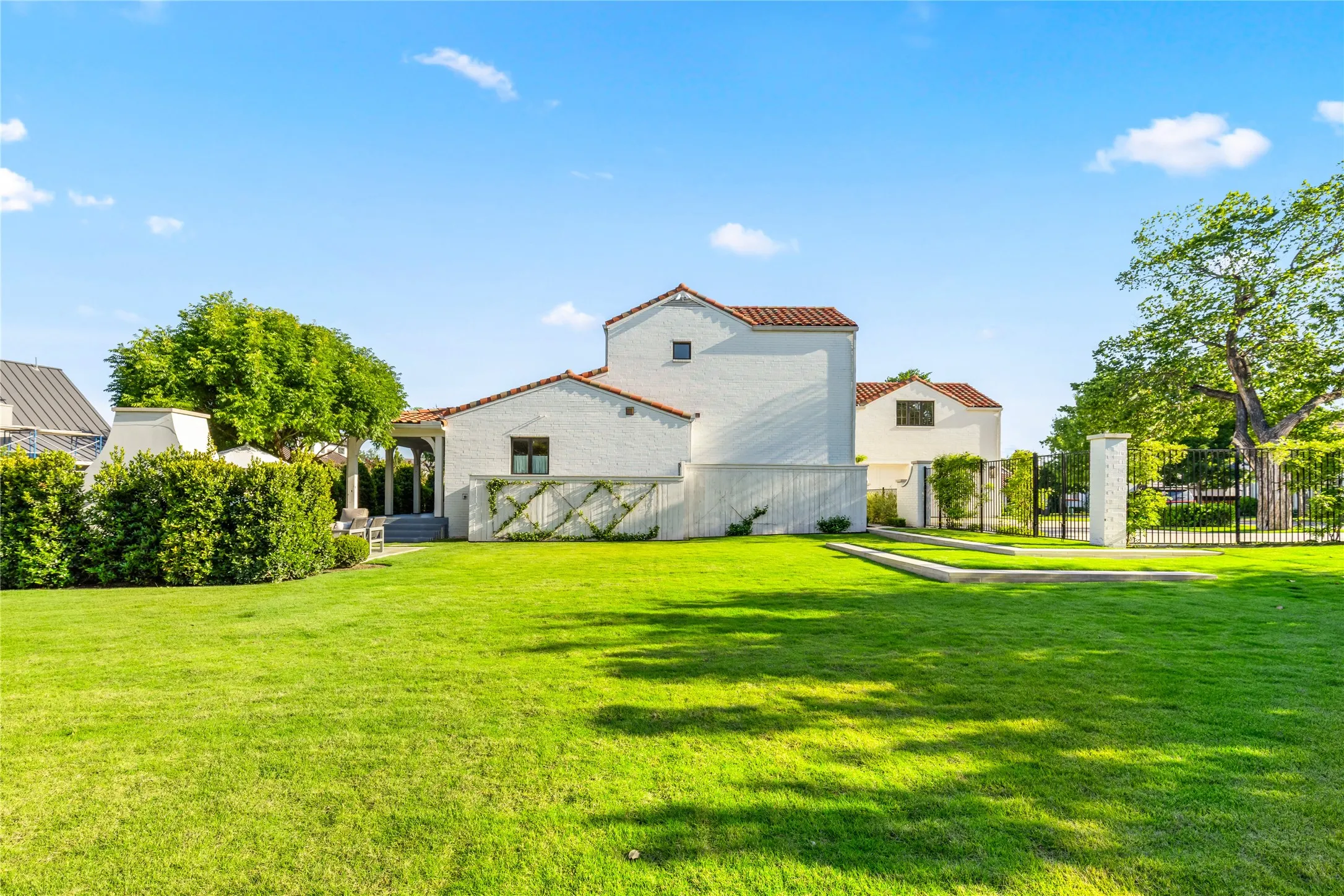 Expansive backyard offers endless possibilities for outdoor living, play, or future enhancements with lush green space and a peaceful, private setting.