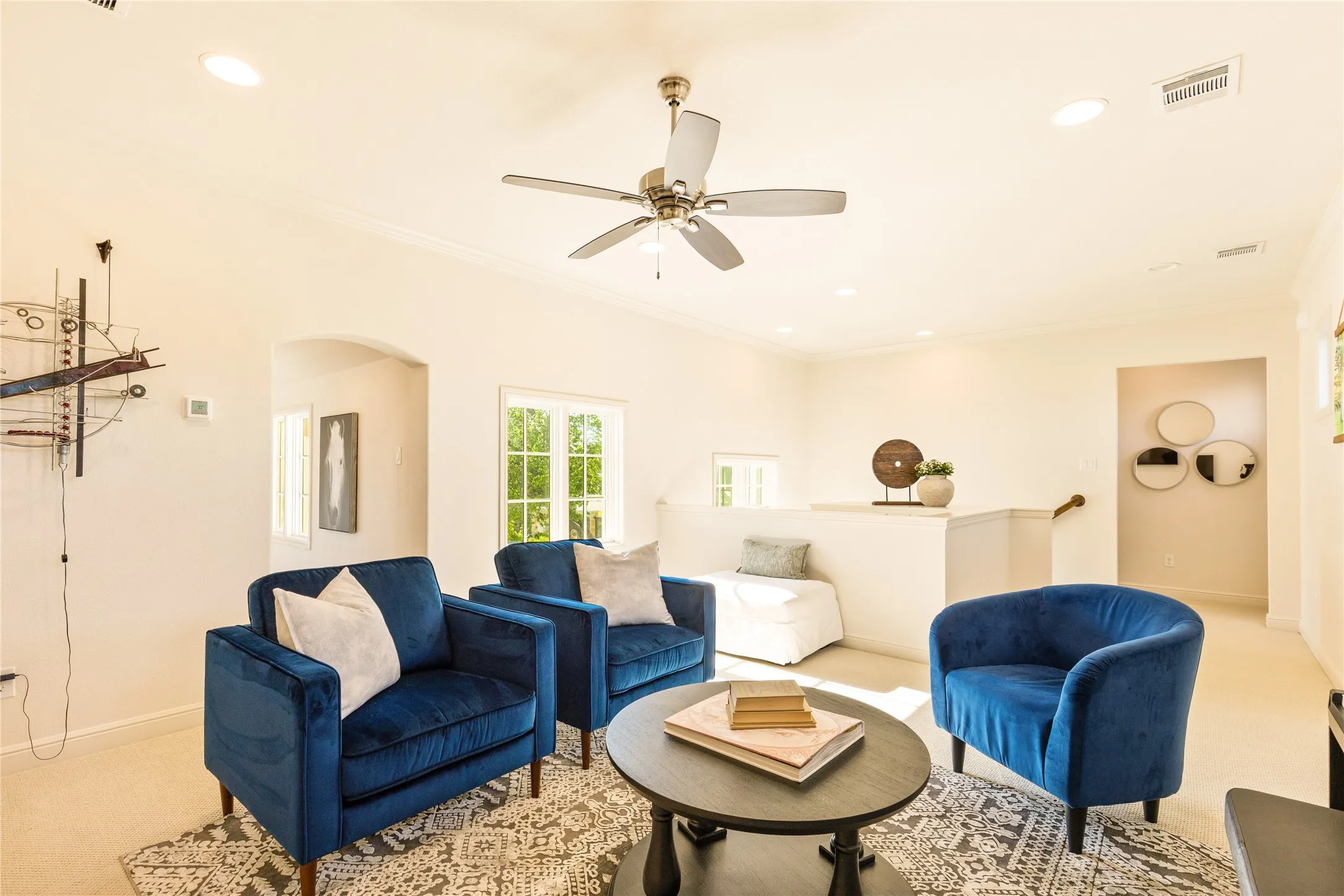 Spacious bonus living area provides the perfect flex space for a media room, playroom, or secondary lounge with stylish finishes and abundant natural light.