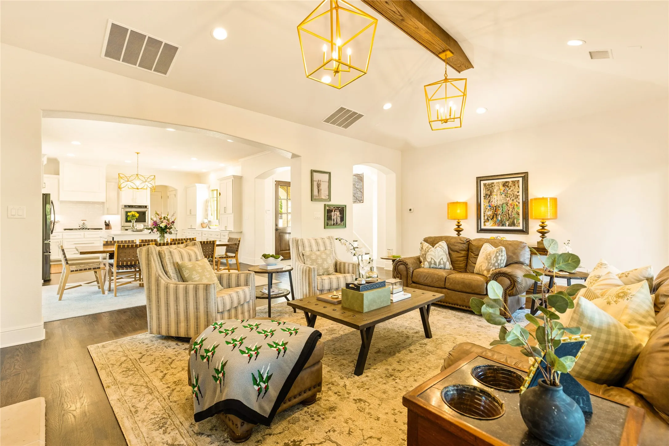 Light filled living spaces feature warm wood accents, custom built ins, and an open concept design that blends comfort and elegance throughout the home.