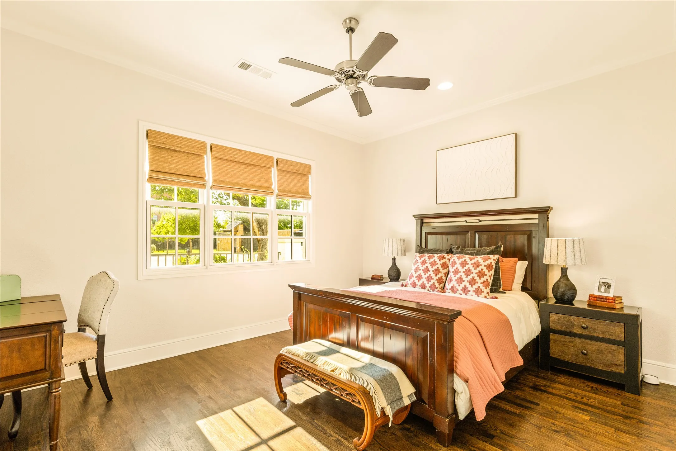 Versatile bonus room offers endless possibilities for a media lounge, game room, home office, or guest retreat with abundant natural light and warm wood flooring.